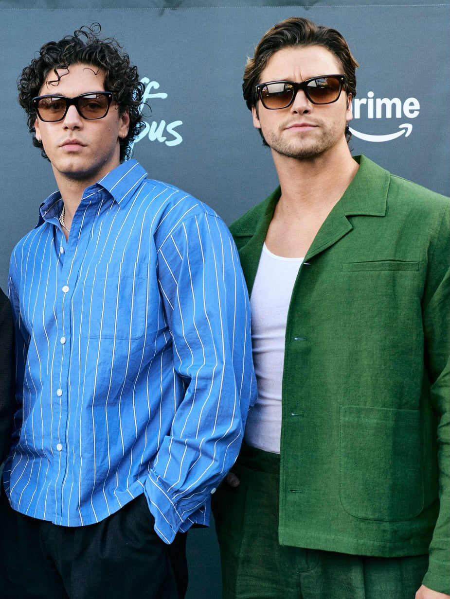 Percival forest green linen boxy overshirt, worn by a model with sunglasses over a white vest.
