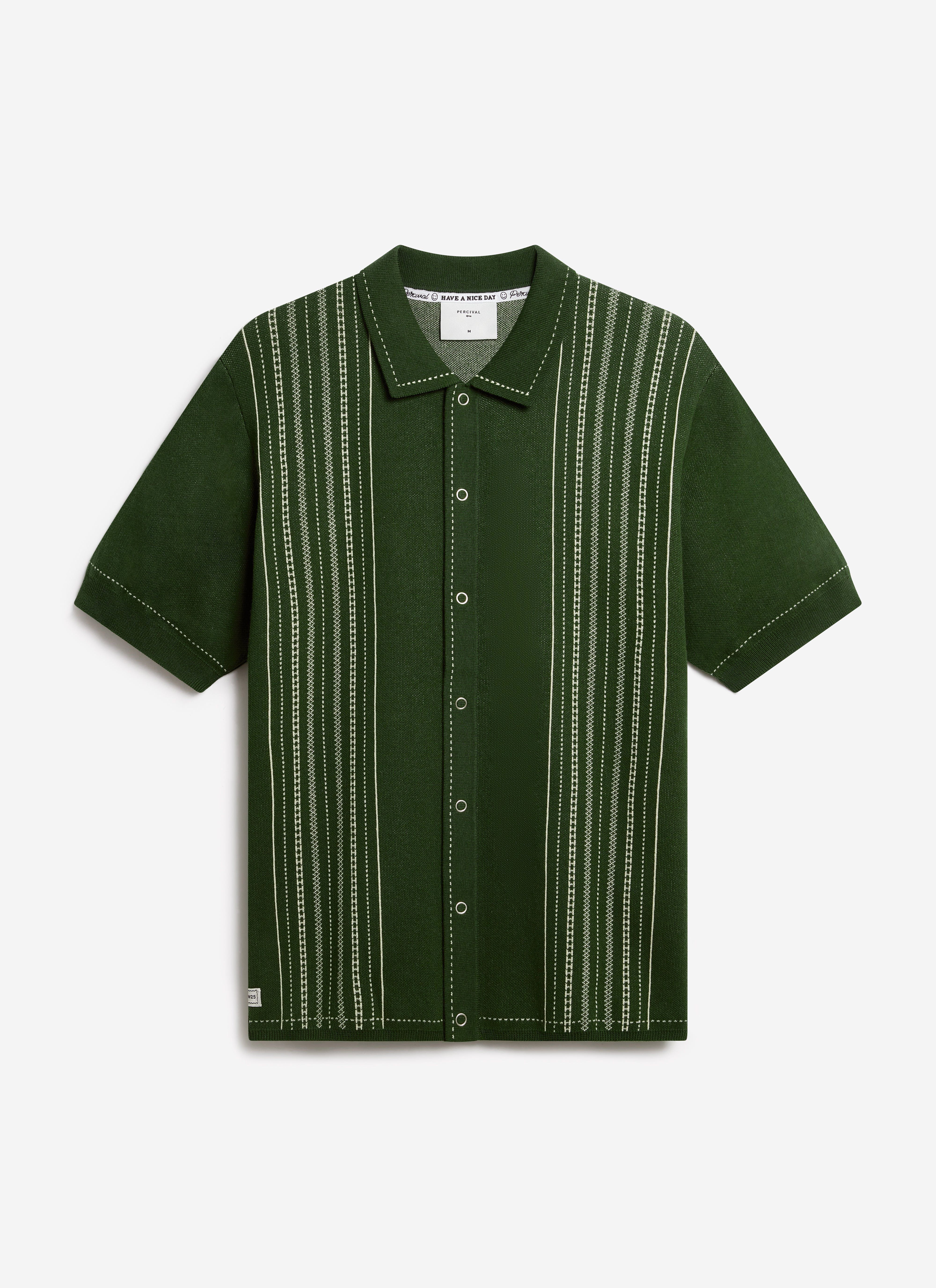 The Percival Accolades Knitted Shirt in forest green, a cotton knit with a jacquard design, laid flat on a white background.