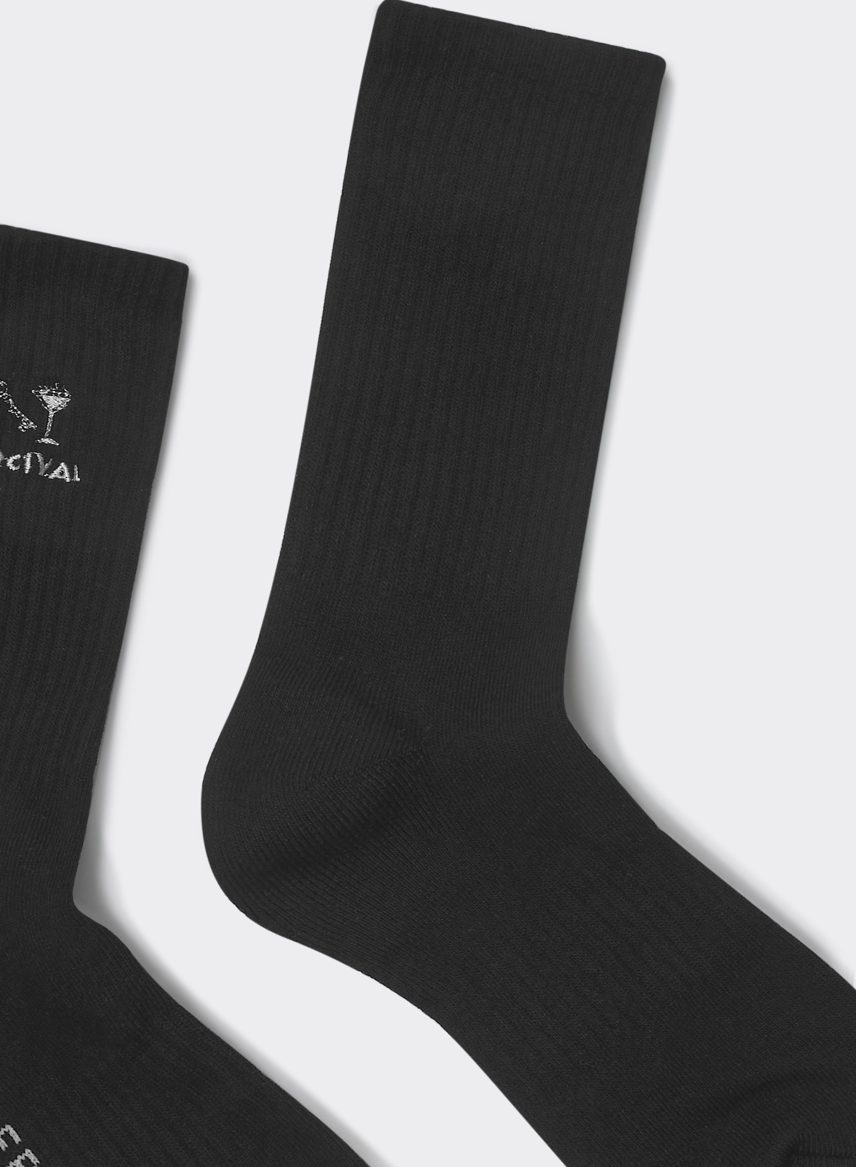 Black Percival Aperitivo socks in ribbed cotton-blend with white cocktail glass embroidery, flat against grey background.