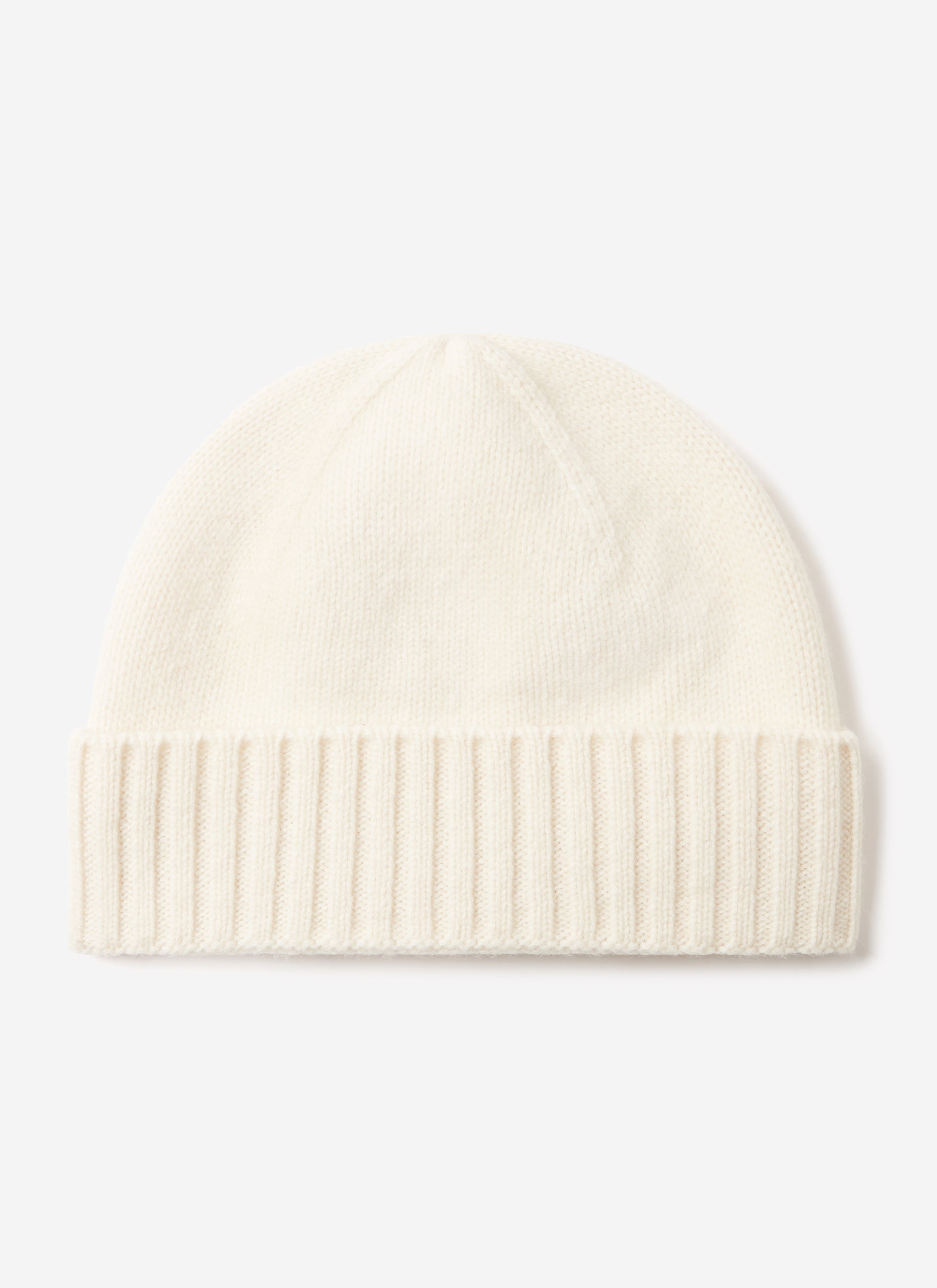The Percival Wool Beanie in ecru, a classic ribbed knit with a folded cuff, photographed against a white background.