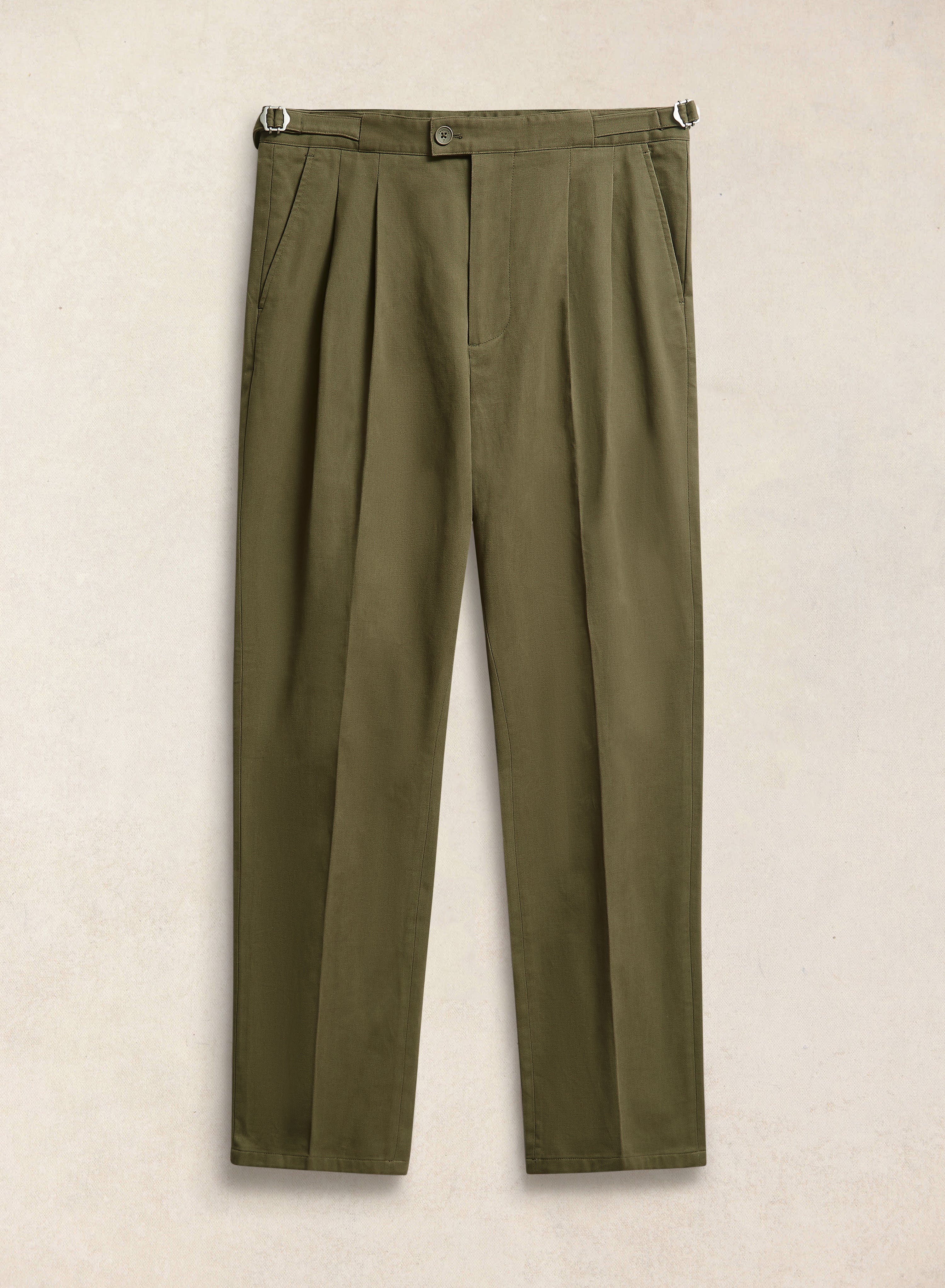 A flat-lay of the Percival Blake double pleated tailored trousers in forest green brushed moleskin with side adjusters.