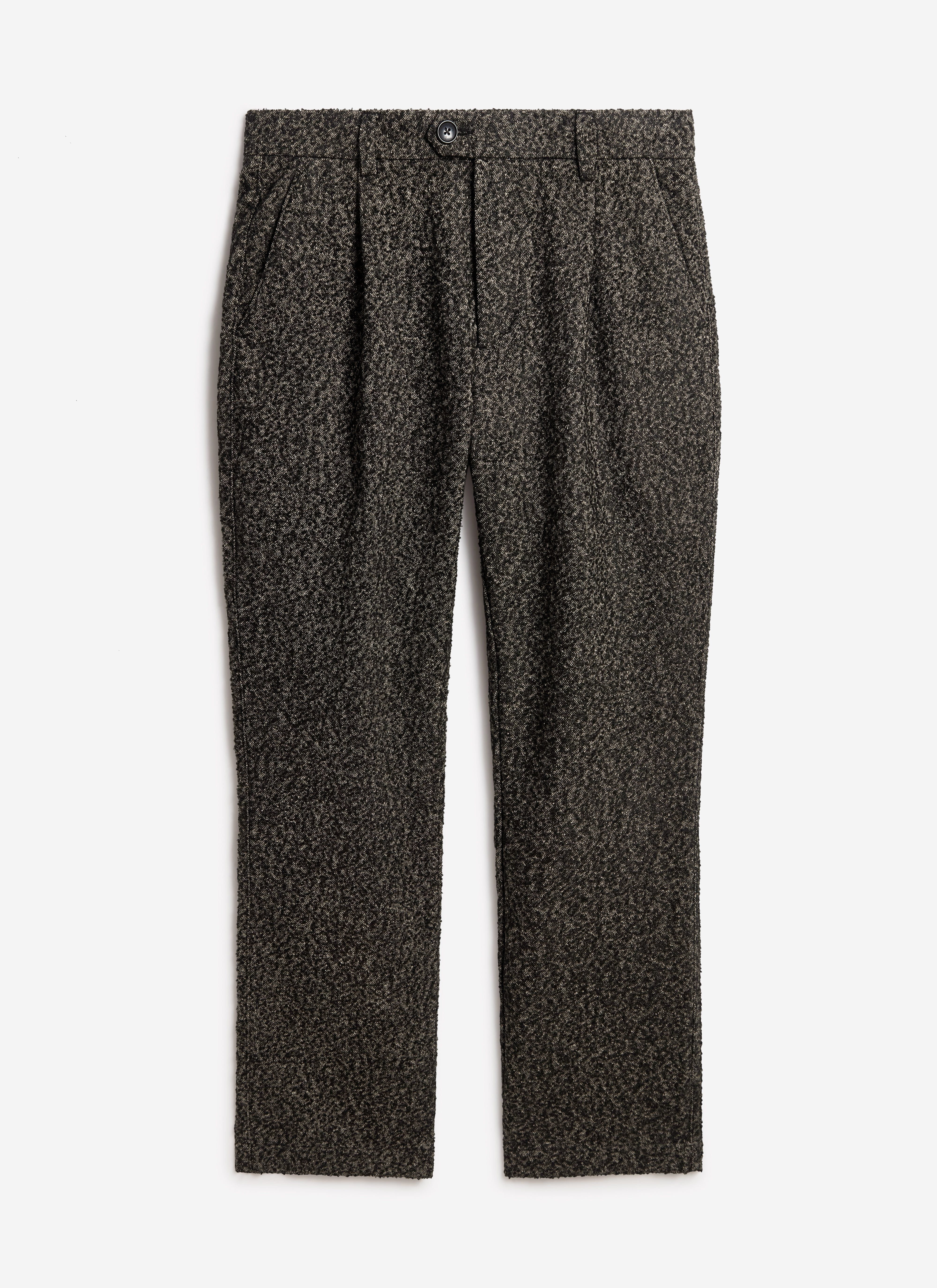 A flat lay of the Percival Blyton Trousers in a grey nep wool, showcasing the pleated front and textured fabric.