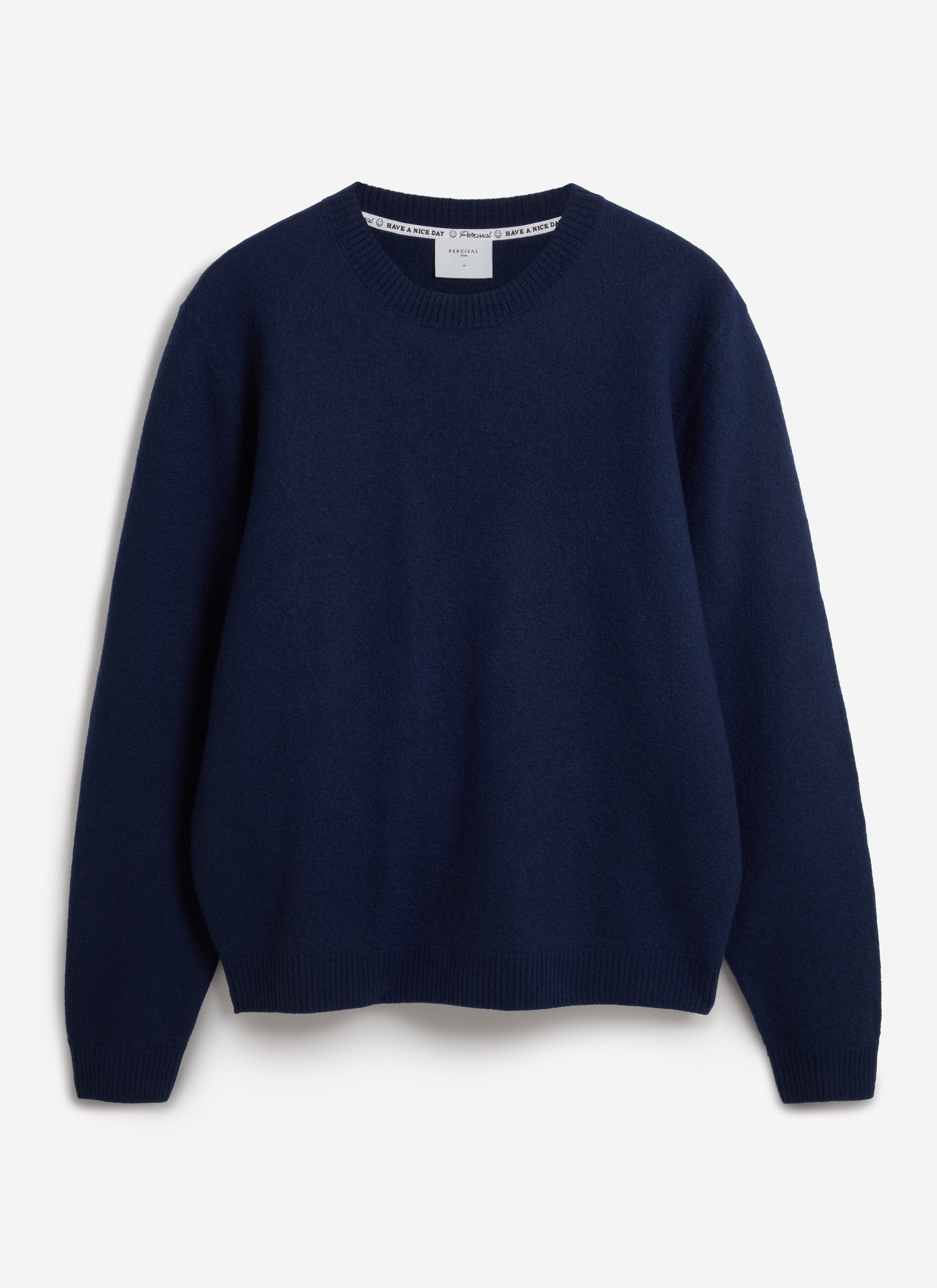 A flat lay of the navy Felted Regular Jumper in merino wool by Percival, shot against a clean white background.