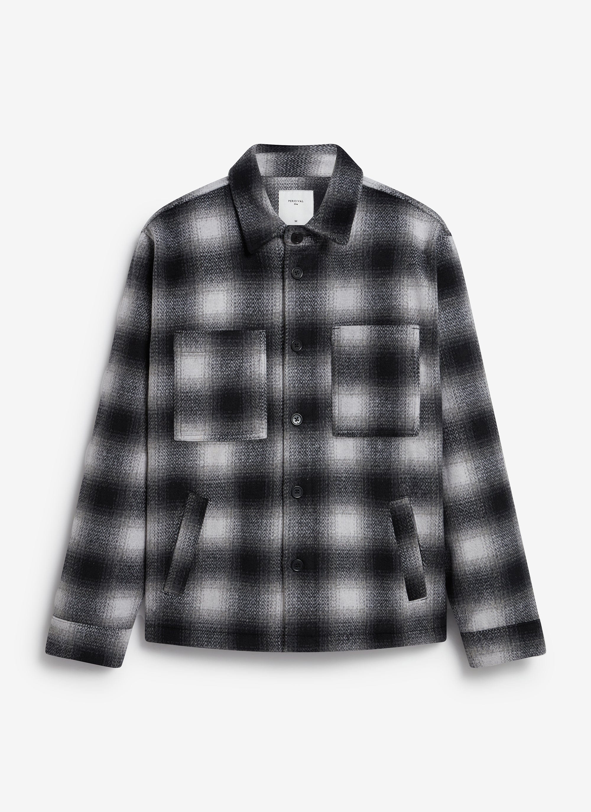The Percival Check Overshirt in a grey and black brushed wool blend, laid flat against a plain white background.