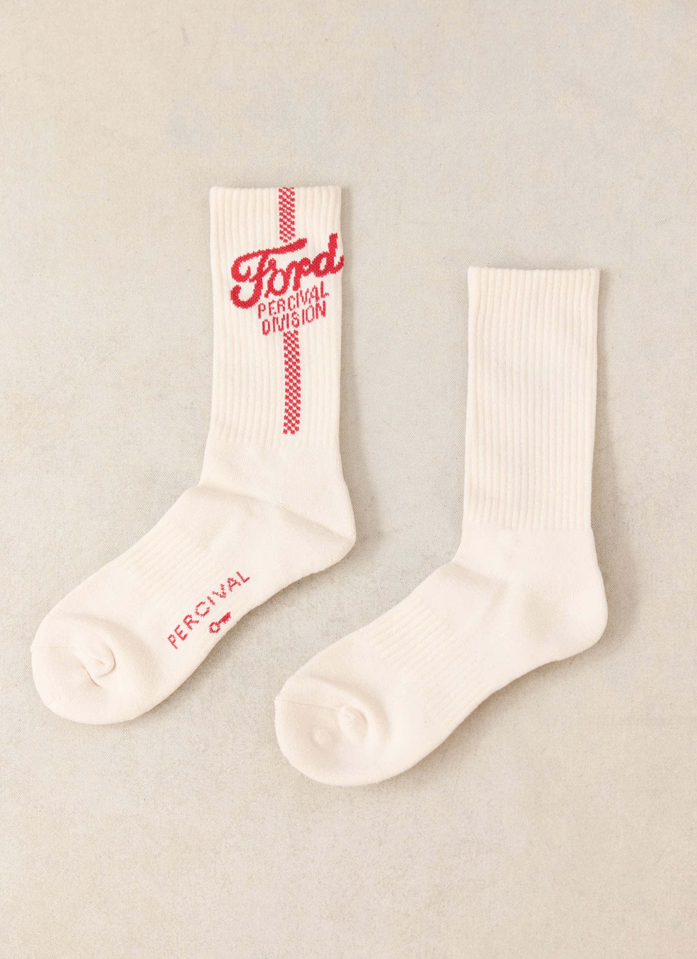 Ford x Percival cream jacquard socks featuring a red logo and checkerboard stripe, crafted from a soft cotton blend.
