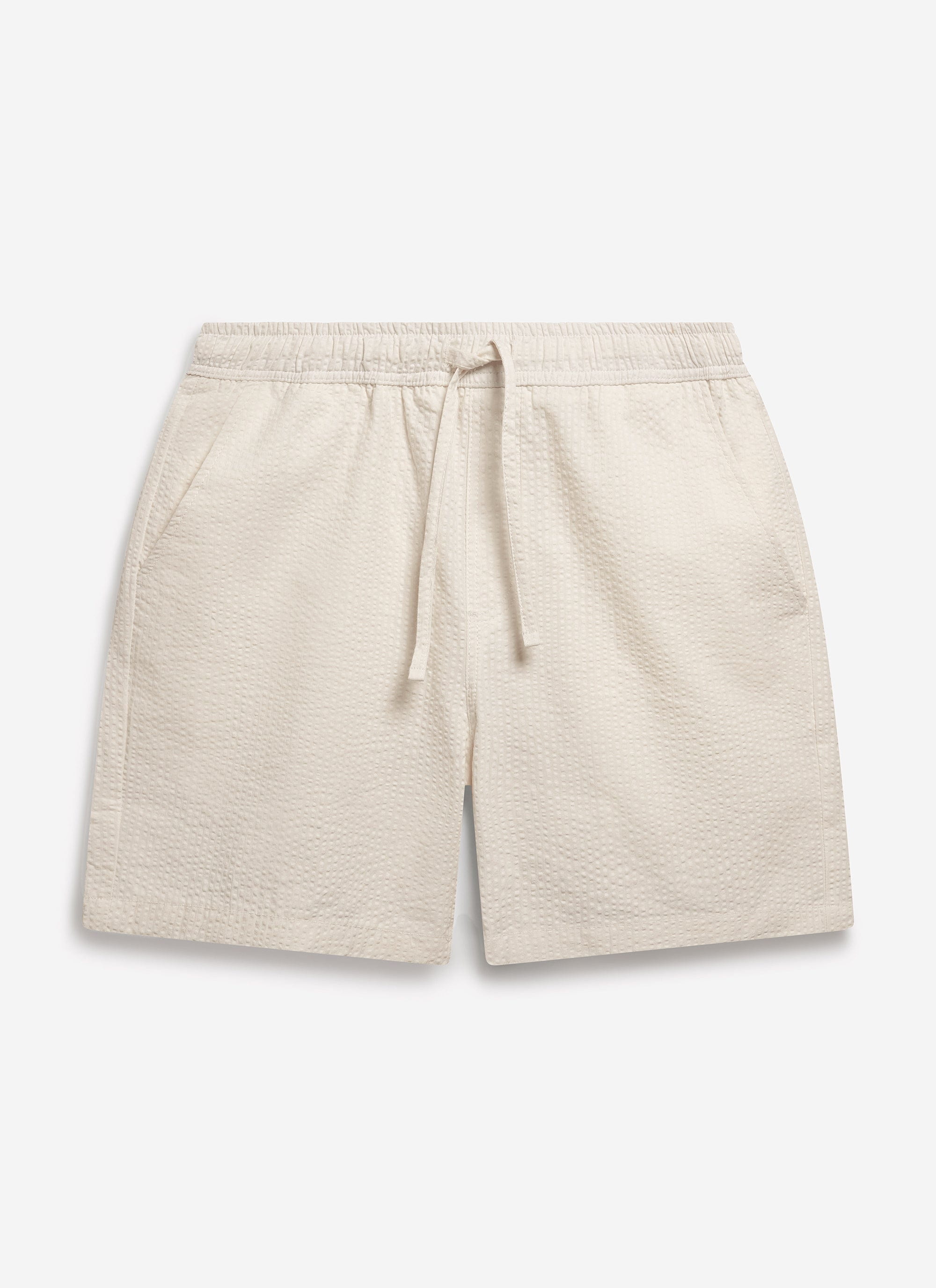A front-on studio shot of the Percival Classic Shorts in cream, made from textured seersucker fabric with a drawstring waist.