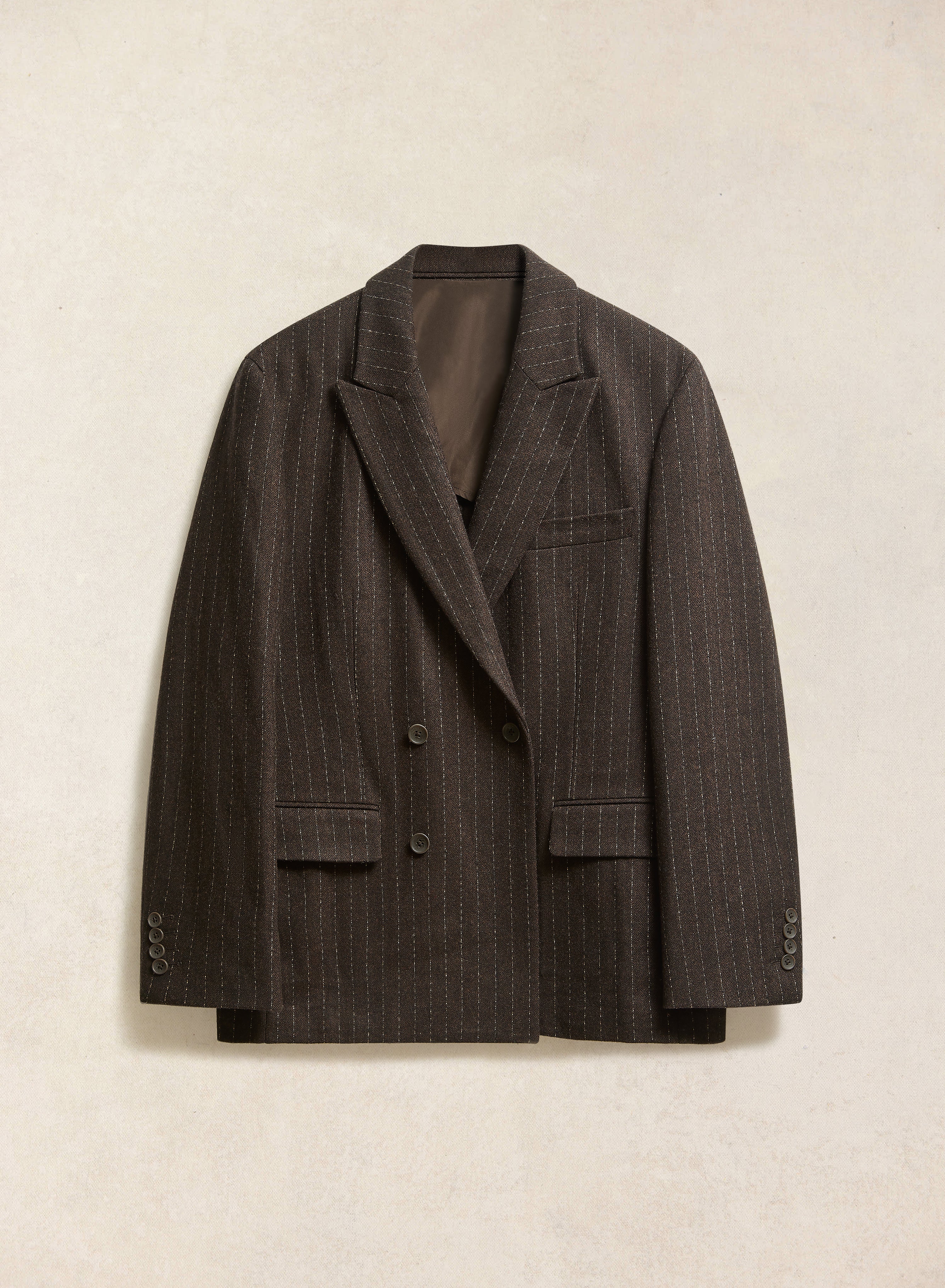 The Percival Clifton double-breasted blazer in espresso brown wool, featuring a subtle textured pinstripe design.