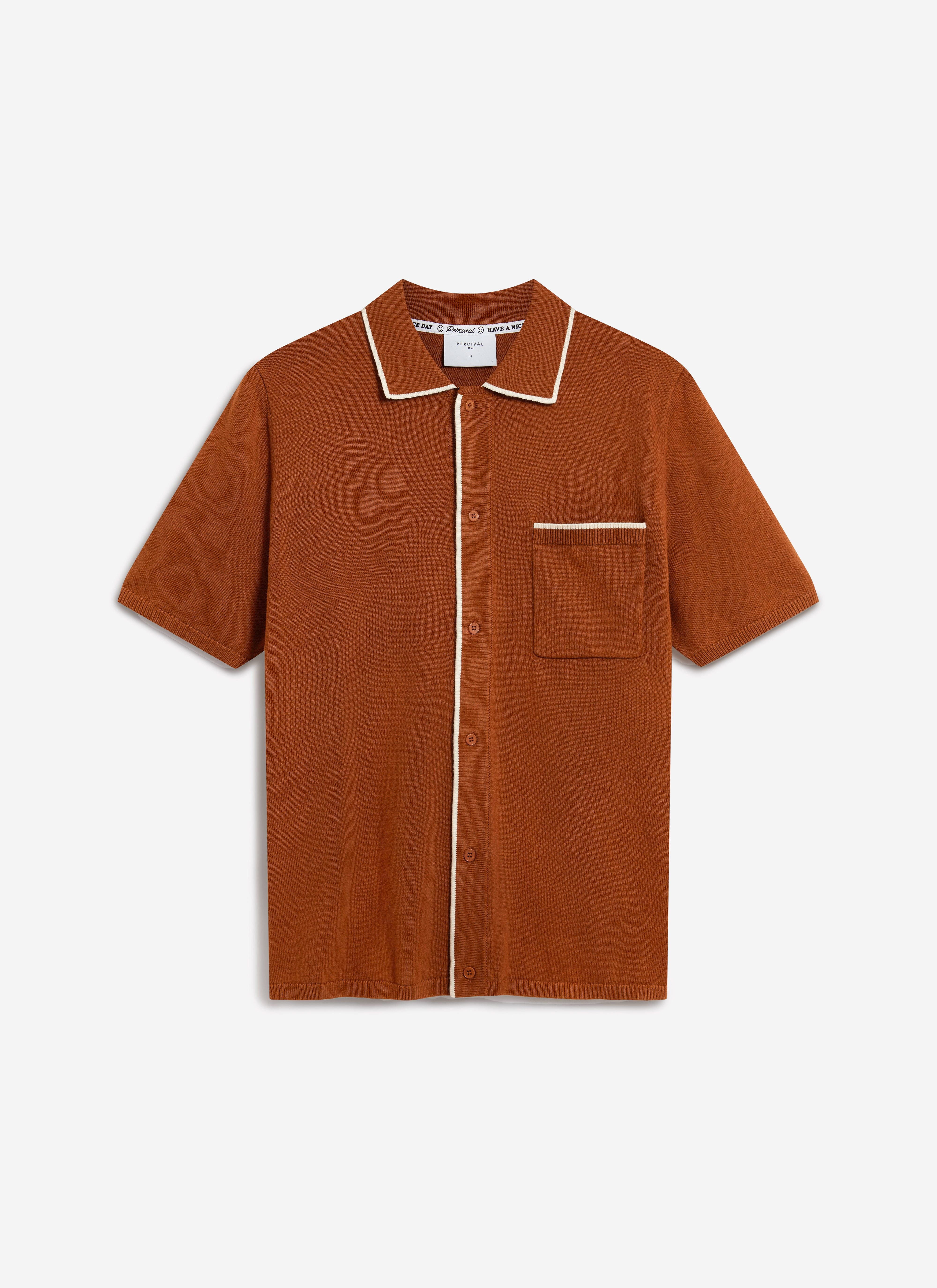 The Percival Contrast Trim Shirt in rust wool, laid flat against a plain background, showing its white contrast trim.