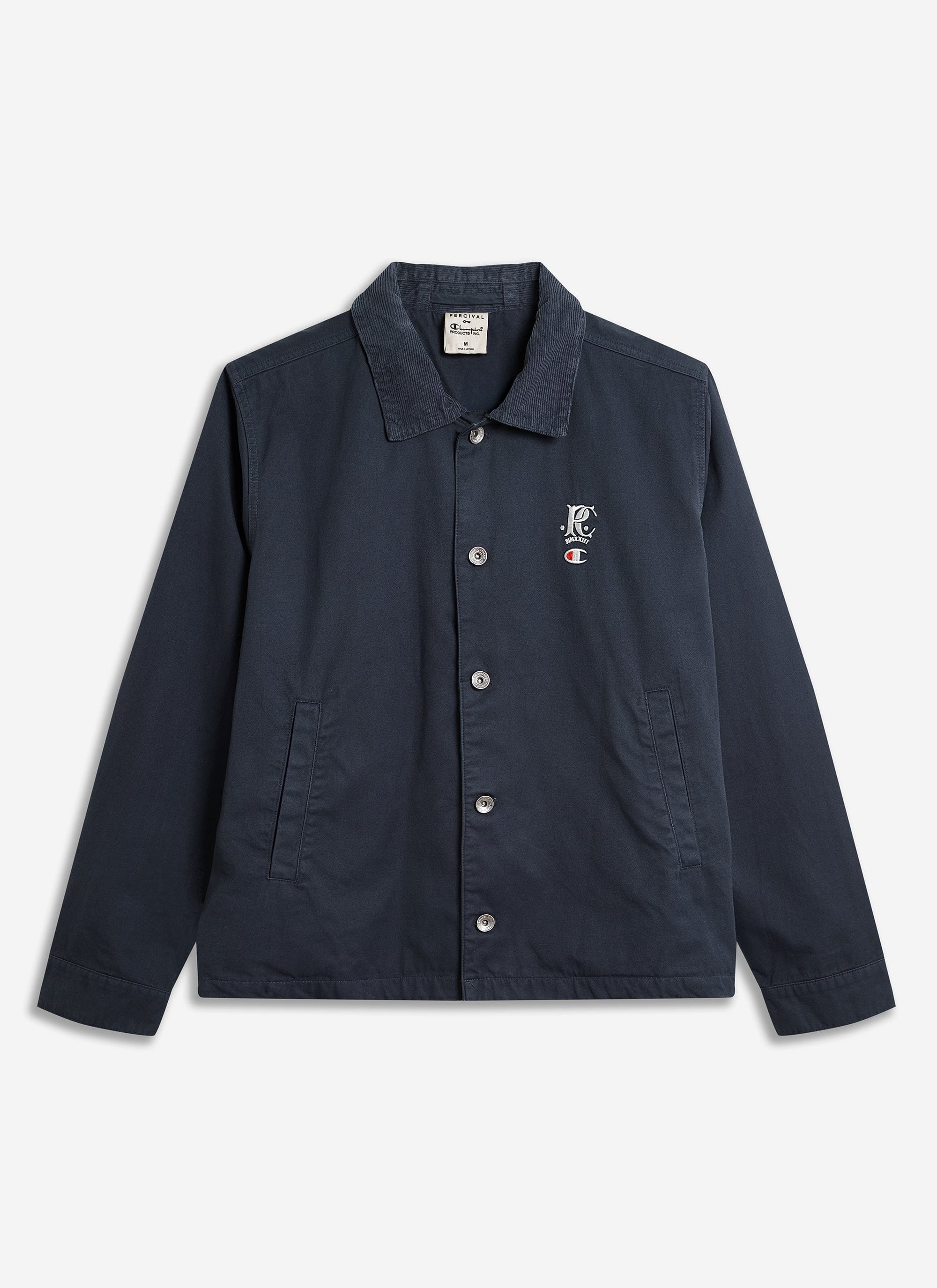 The Champion x Percival Cord Collar Jacket in navy, shown flat to highlight the embroidered chest logo and corduroy collar.