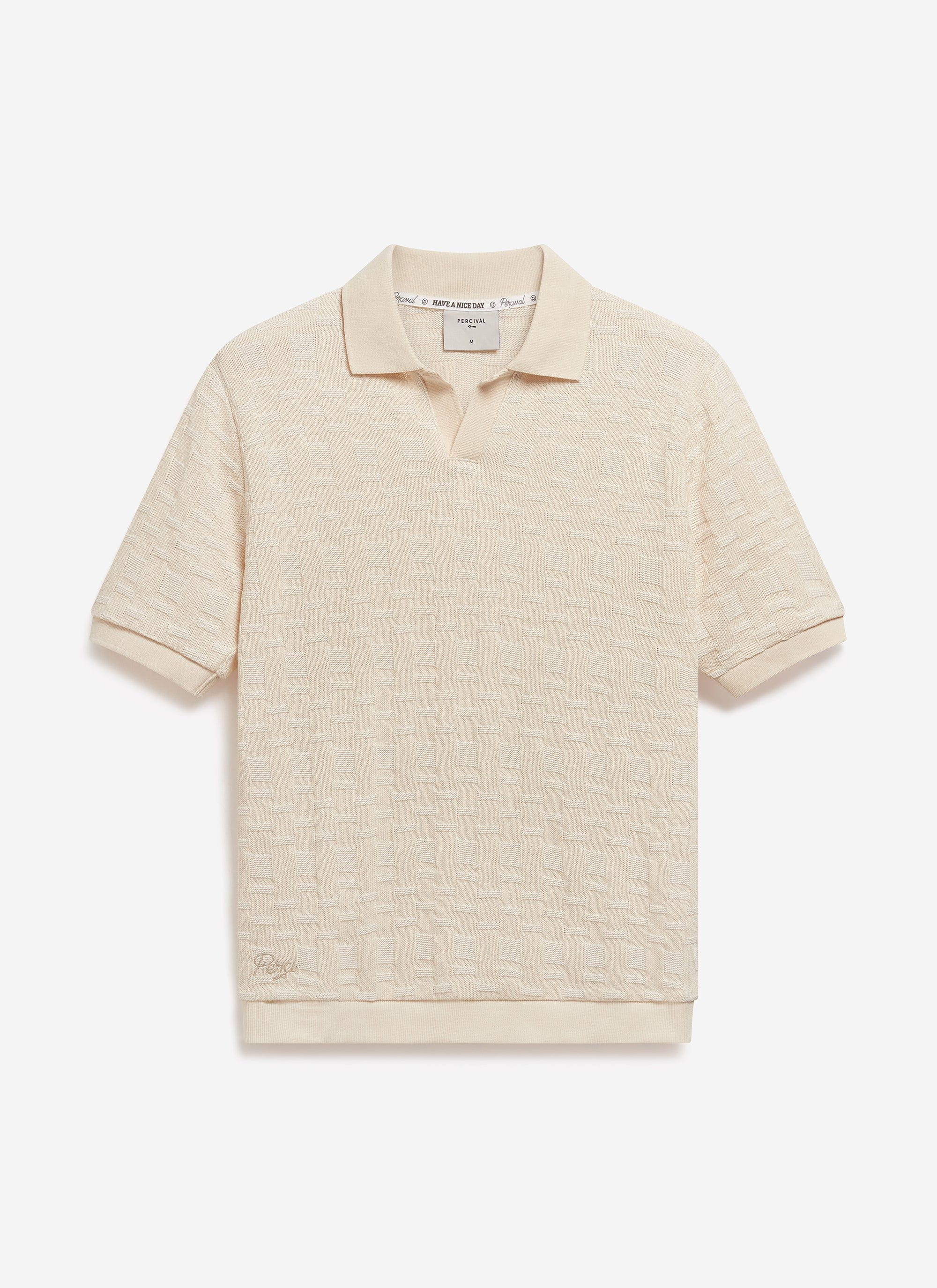 The Percival Deck Negroni Knitted Shirt in ecru, a cotton polo laid flat to display its textured weave and open collar.
