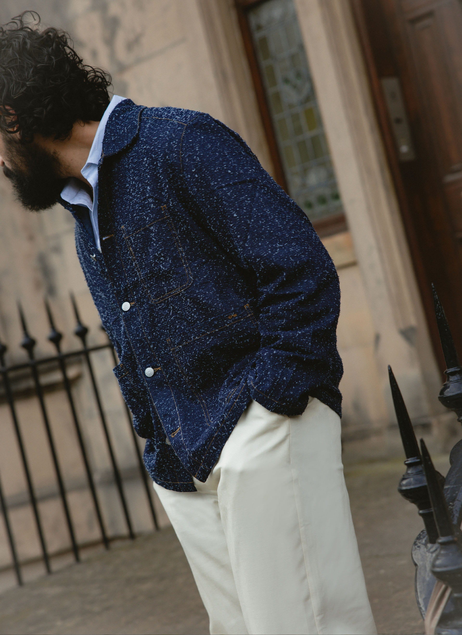 Model in the navy Percival Parsons Chore Jacket, showing the nep flecked cotton texture and contrast stitching.