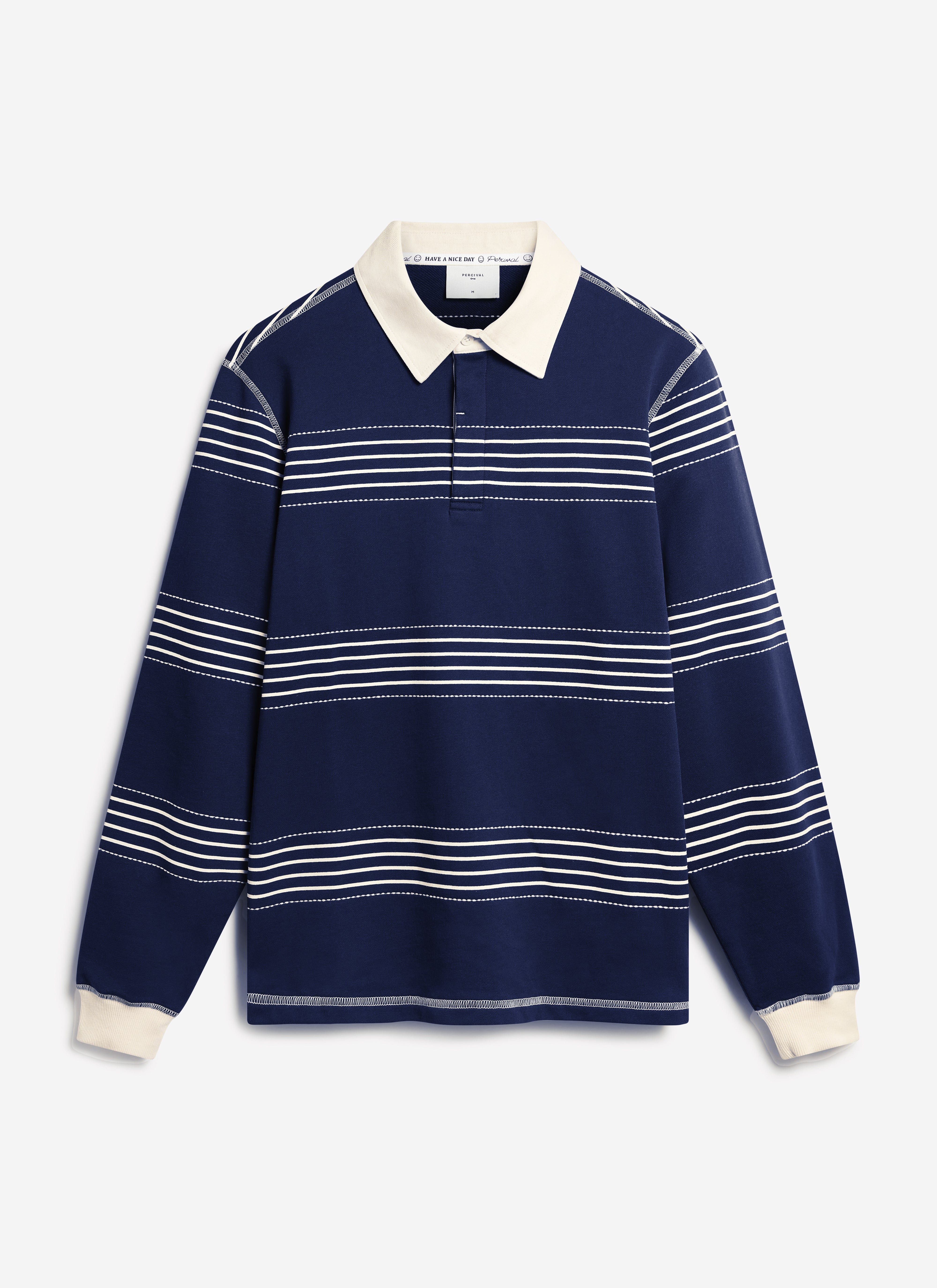 A flat lay of the Percival Editor Striped Rugby Polo in navy, featuring contrast cream collar and horizontal stitch stripes.