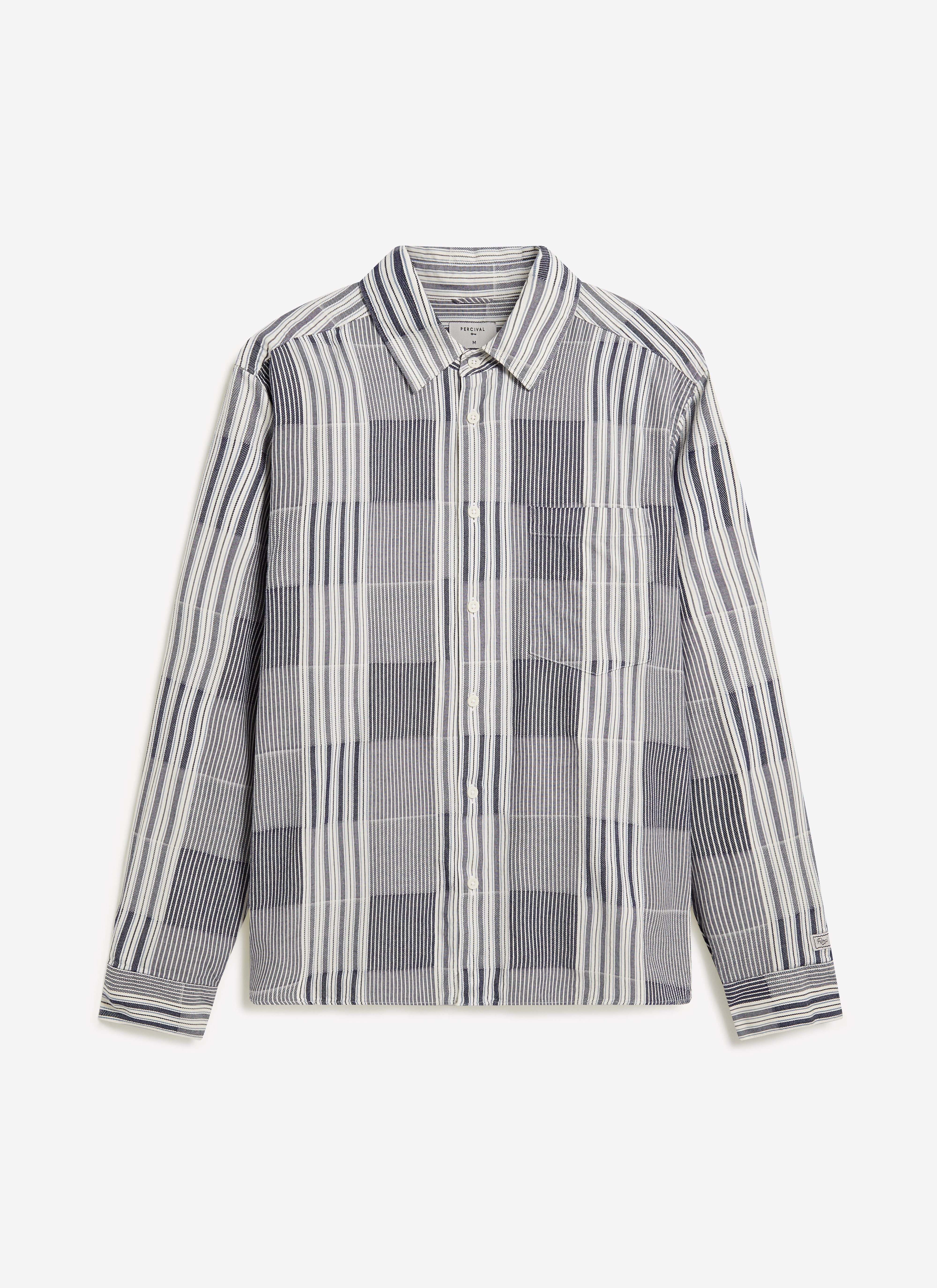 The Percival Epigraph Patchwork Pearce Shirt in blue cotton jacquard, laid flat against a clean white studio background.