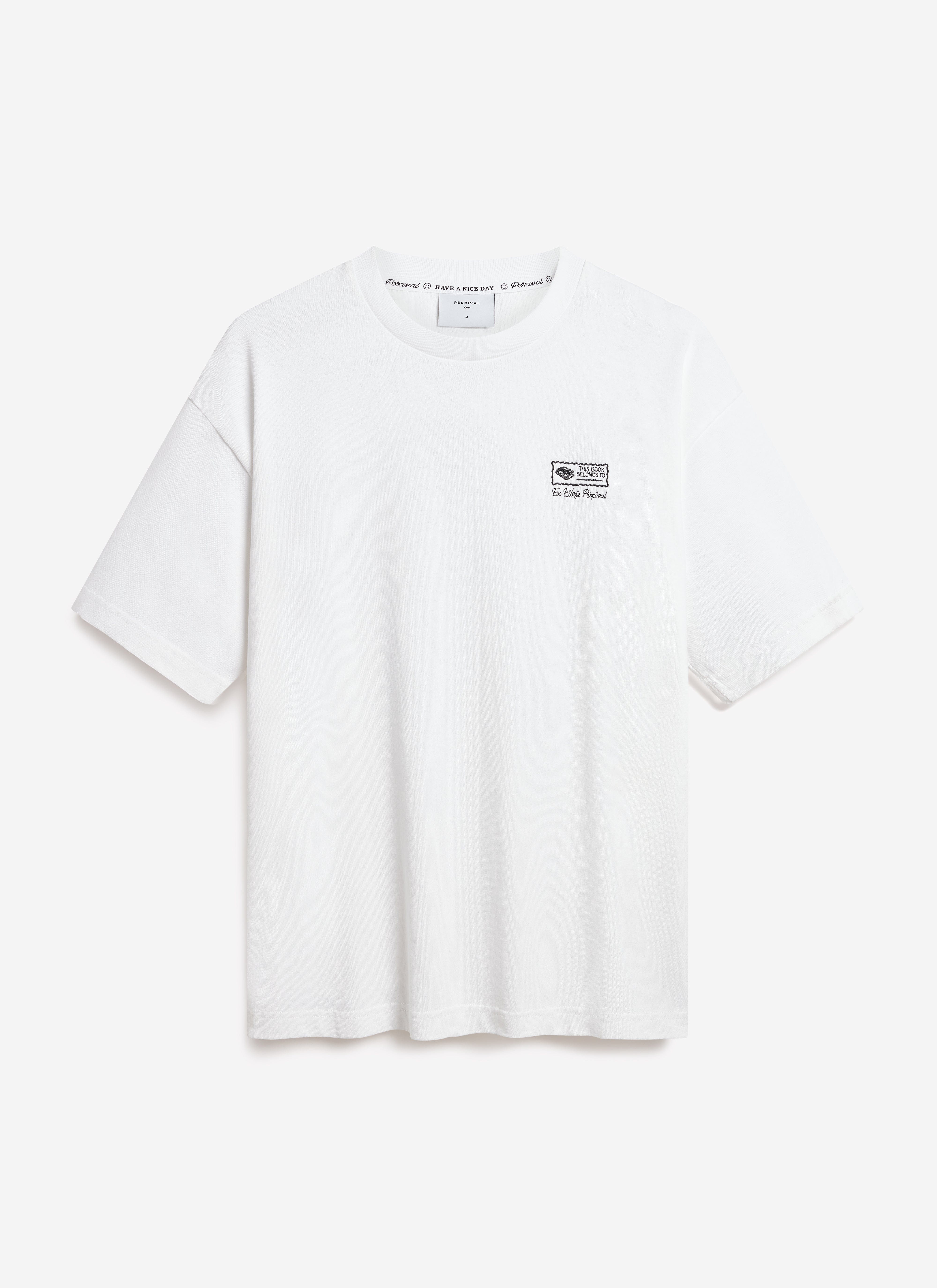 The white oversized Ex Libris t-shirt by Percival, laid flat against a white background to showcase the chest embroidery.