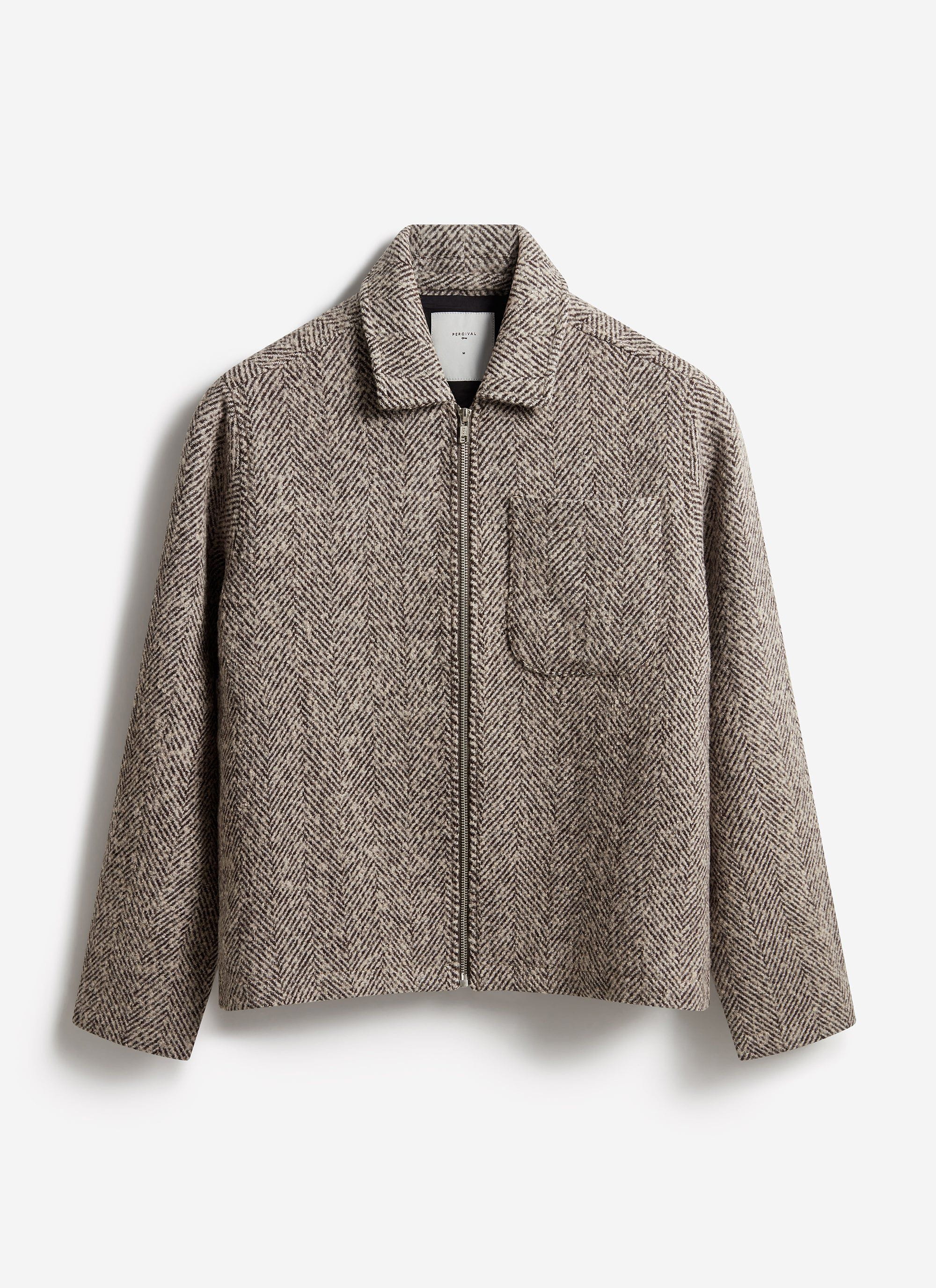The Percival Herringbone Zip Jacket in ecru wool, shown flat against a light background.