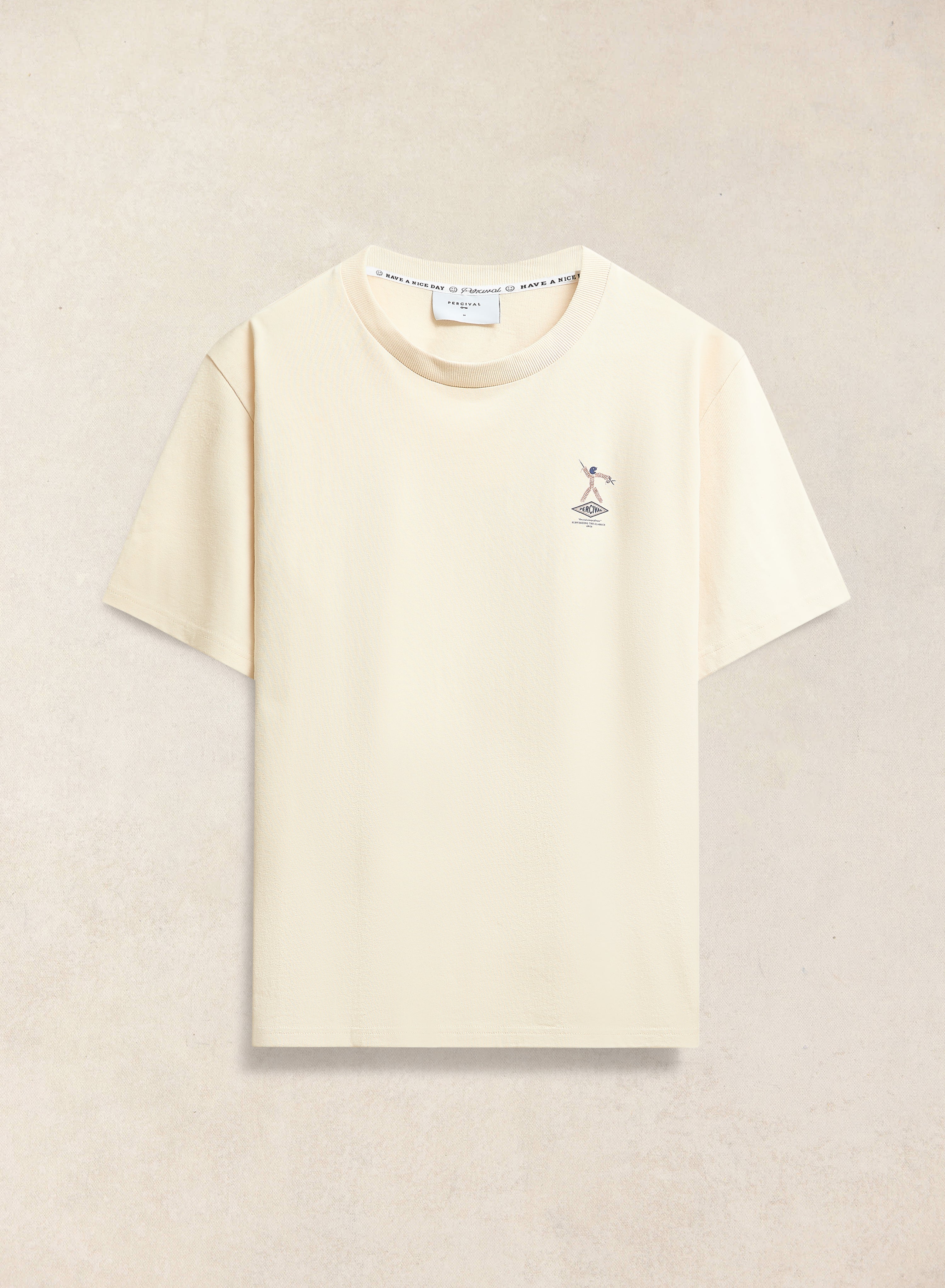 The cream Kingston Oversized T Shirt from Percival, crafted from organic cotton with a small graphic on the chest.
