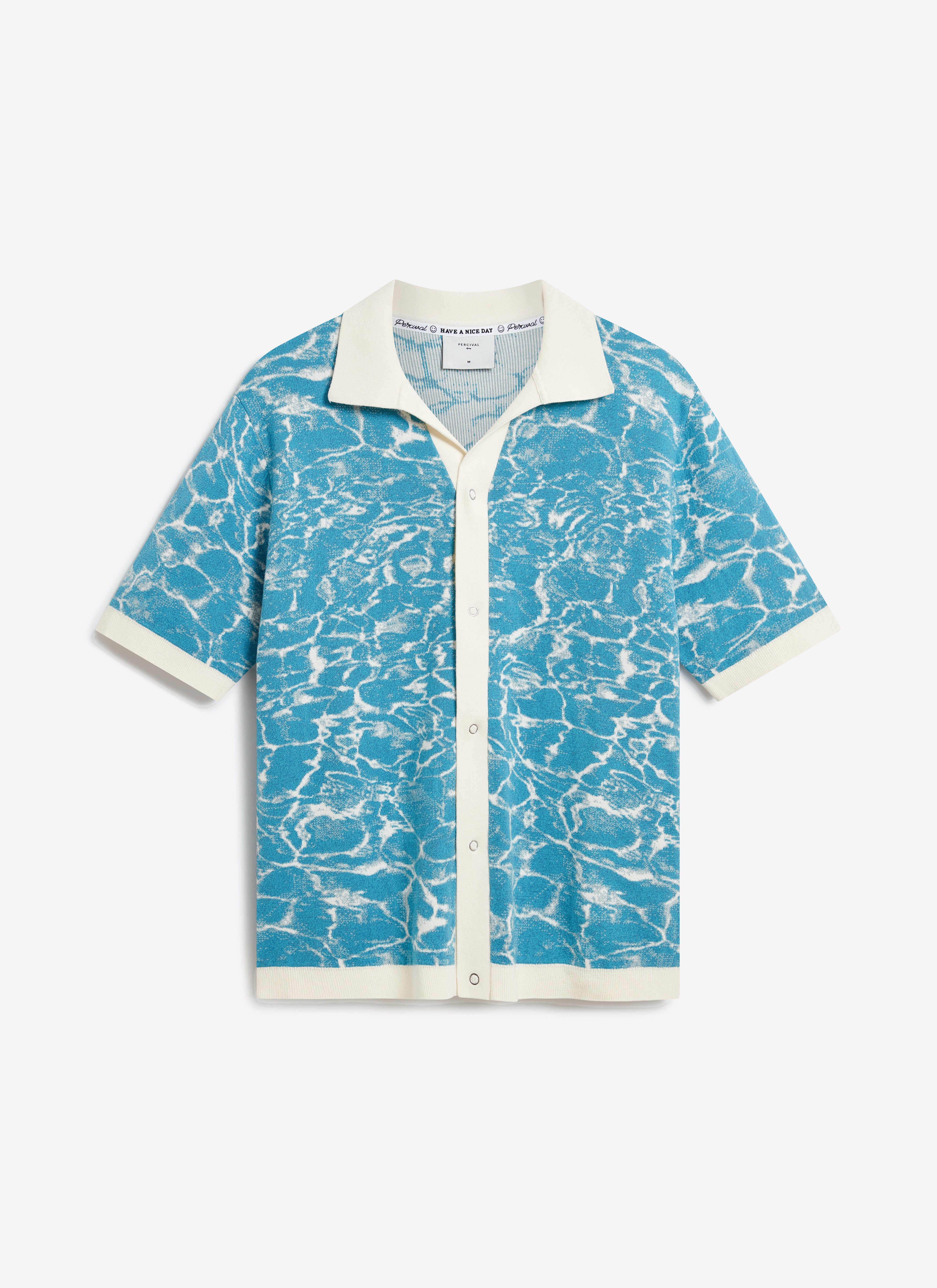 The Percival Farraris Negroni Knitted Shirt in blue and white, featuring an ocean-inspired pattern in a breathable cotton.