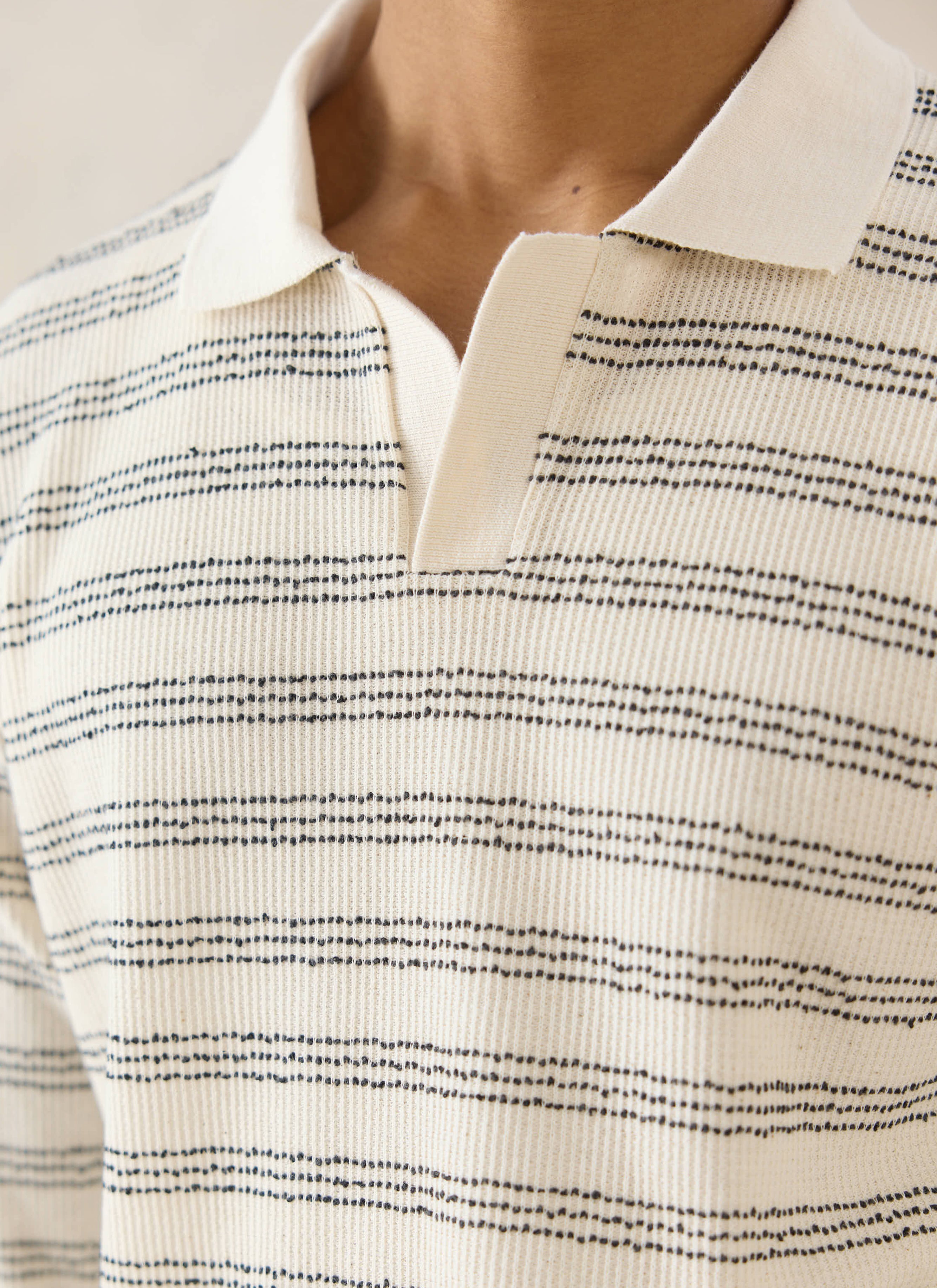 Percival Laurent long sleeve polo in cream, featuring navy dotted stripes and a textured cotton-blend finish.