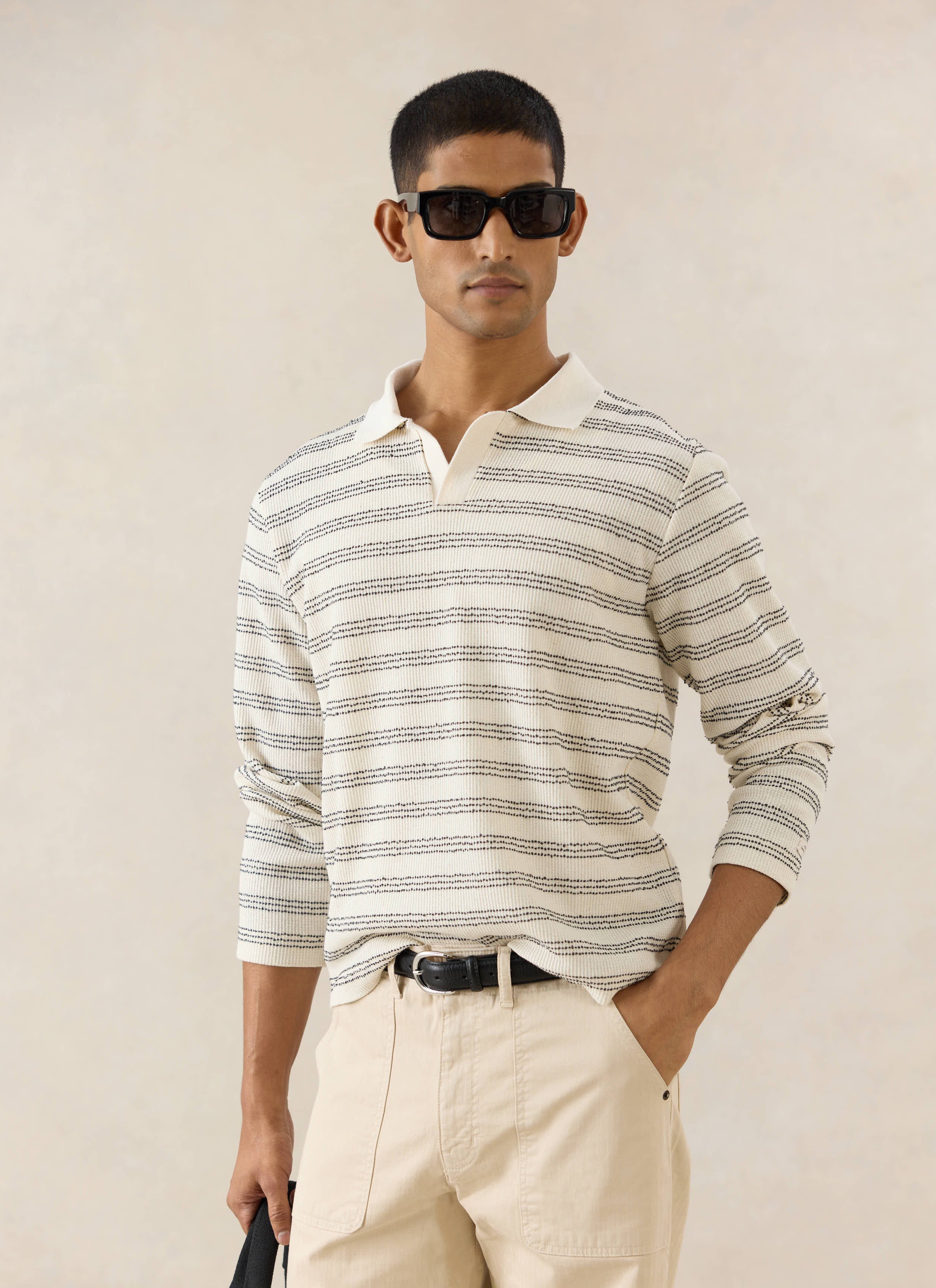 Percival cream Laurent Long Sleeve Polo with dark stripes, styled with Lucas carpenter trousers for the new season.