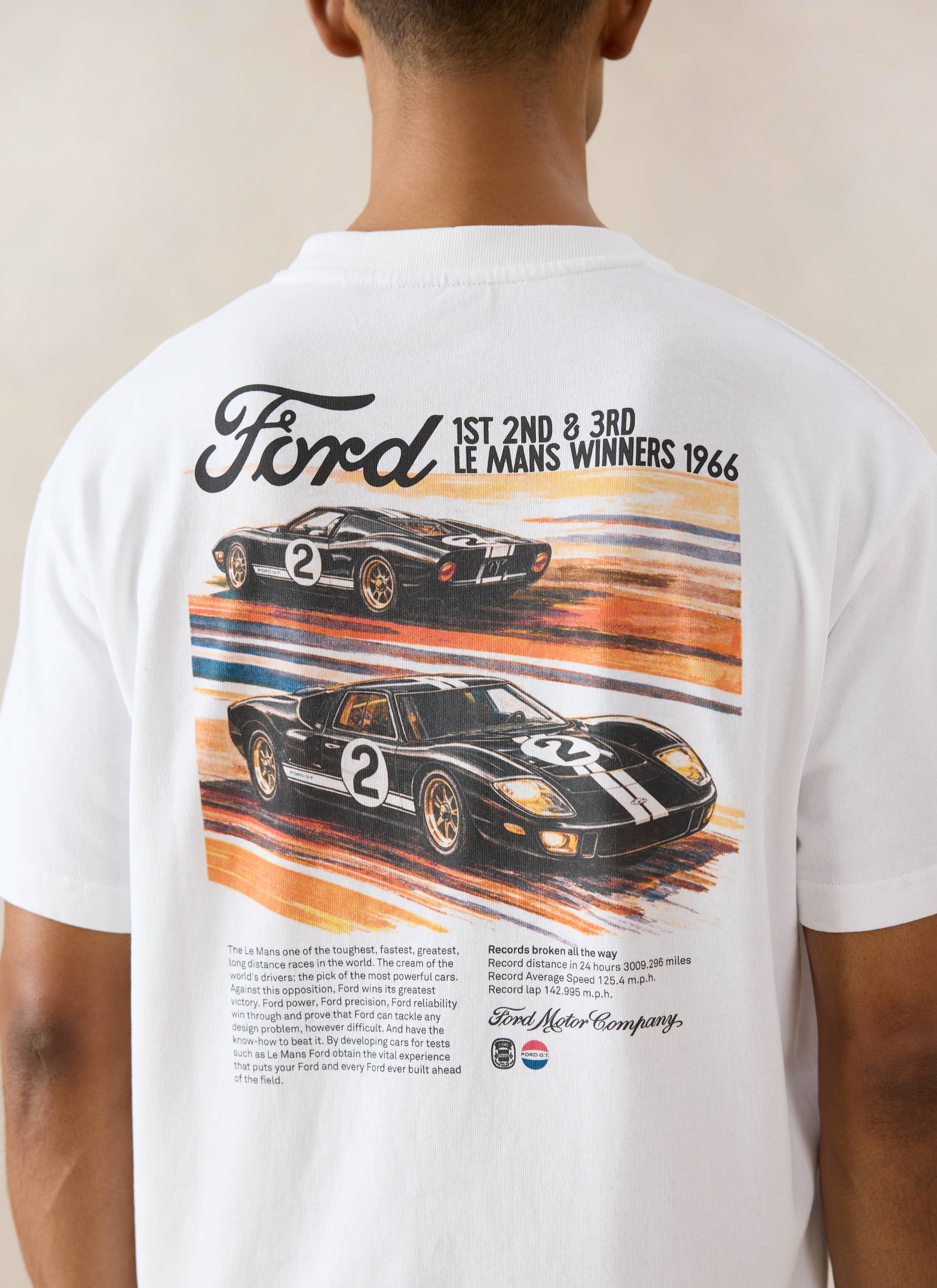 White organic cotton Percival x Ford oversized t-shirt with a vintage 1966 Le Mans racing graphic on the back.