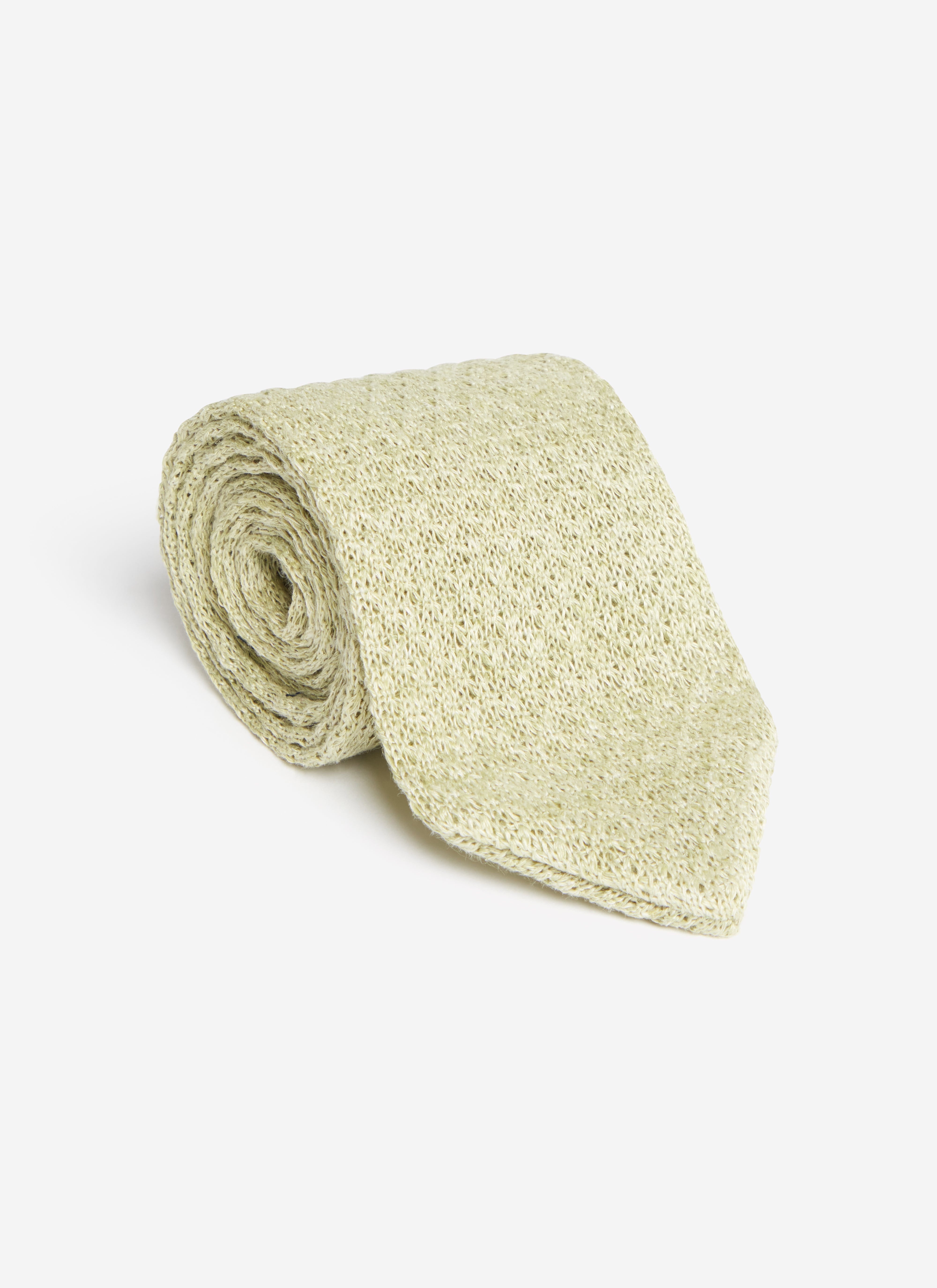 A studio shot of the Percival Linen Tie in Forest Marl, rolled up to showcase its textured marled linen weave.