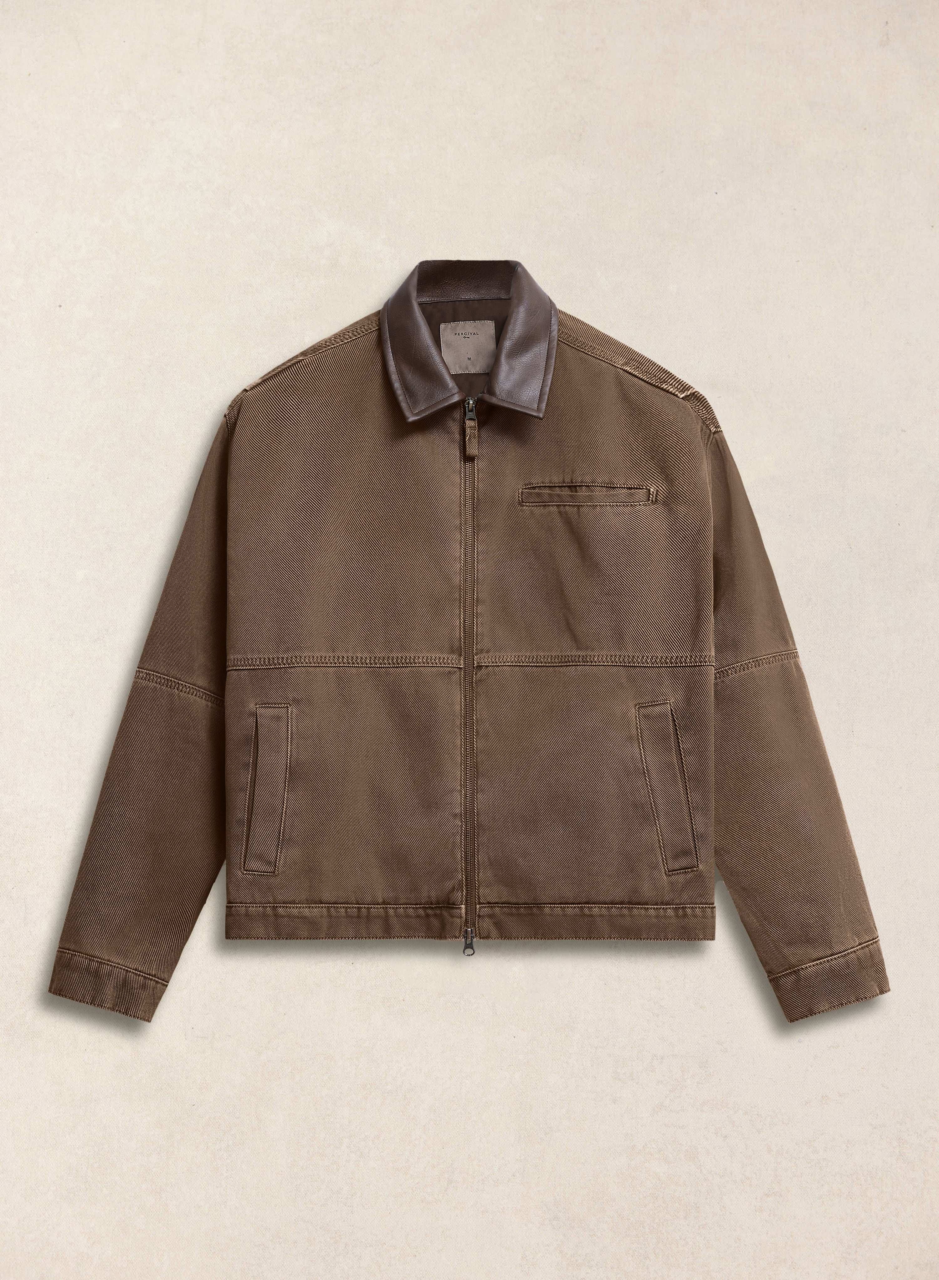 Studio packshot of the Percival mocha brown cotton twill jacket with contrast collar and zip-through front.
