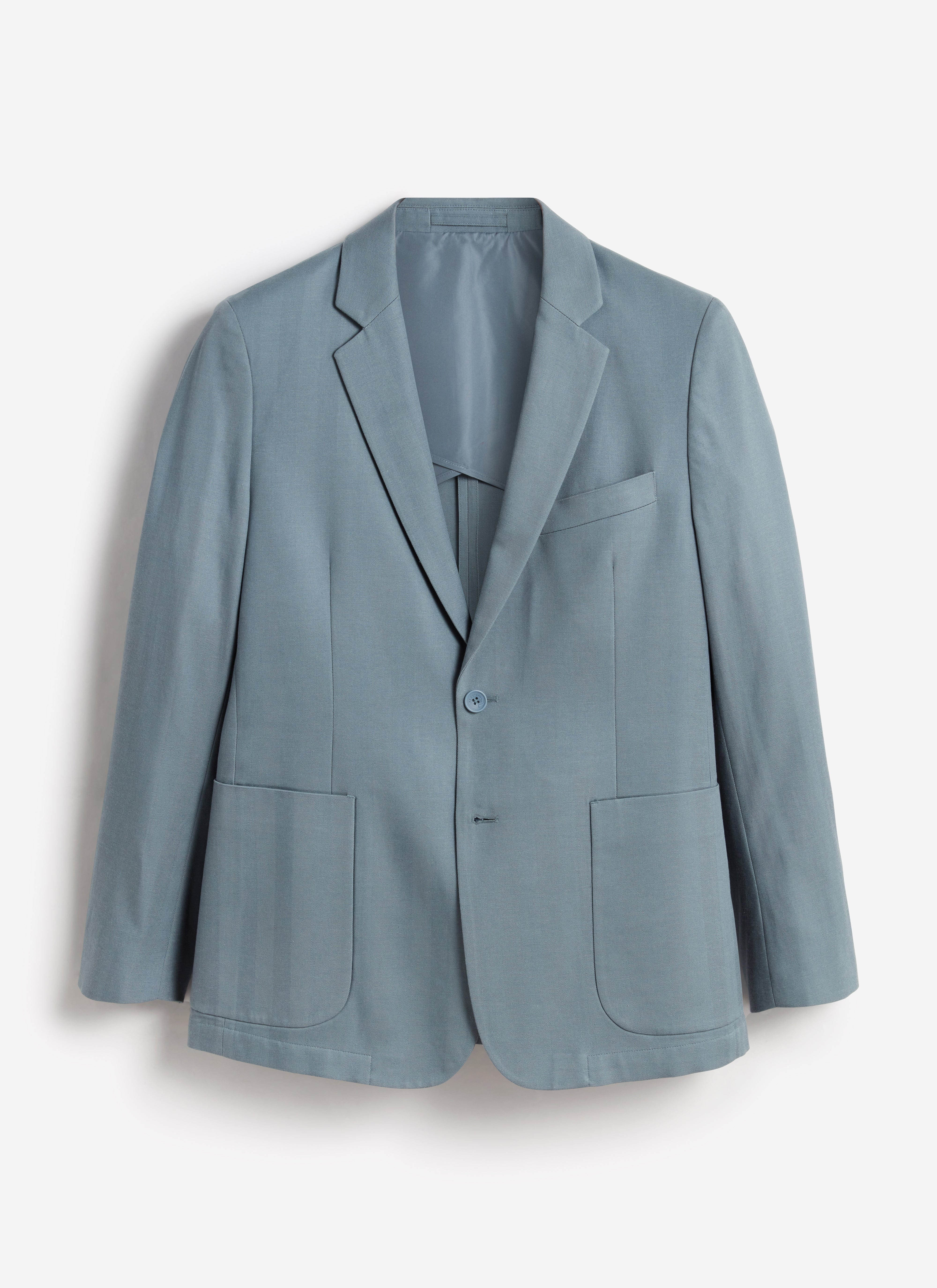 A flat lay of the Percival Lyocell Regular Blazer in slate blue, shot against a clean white background.