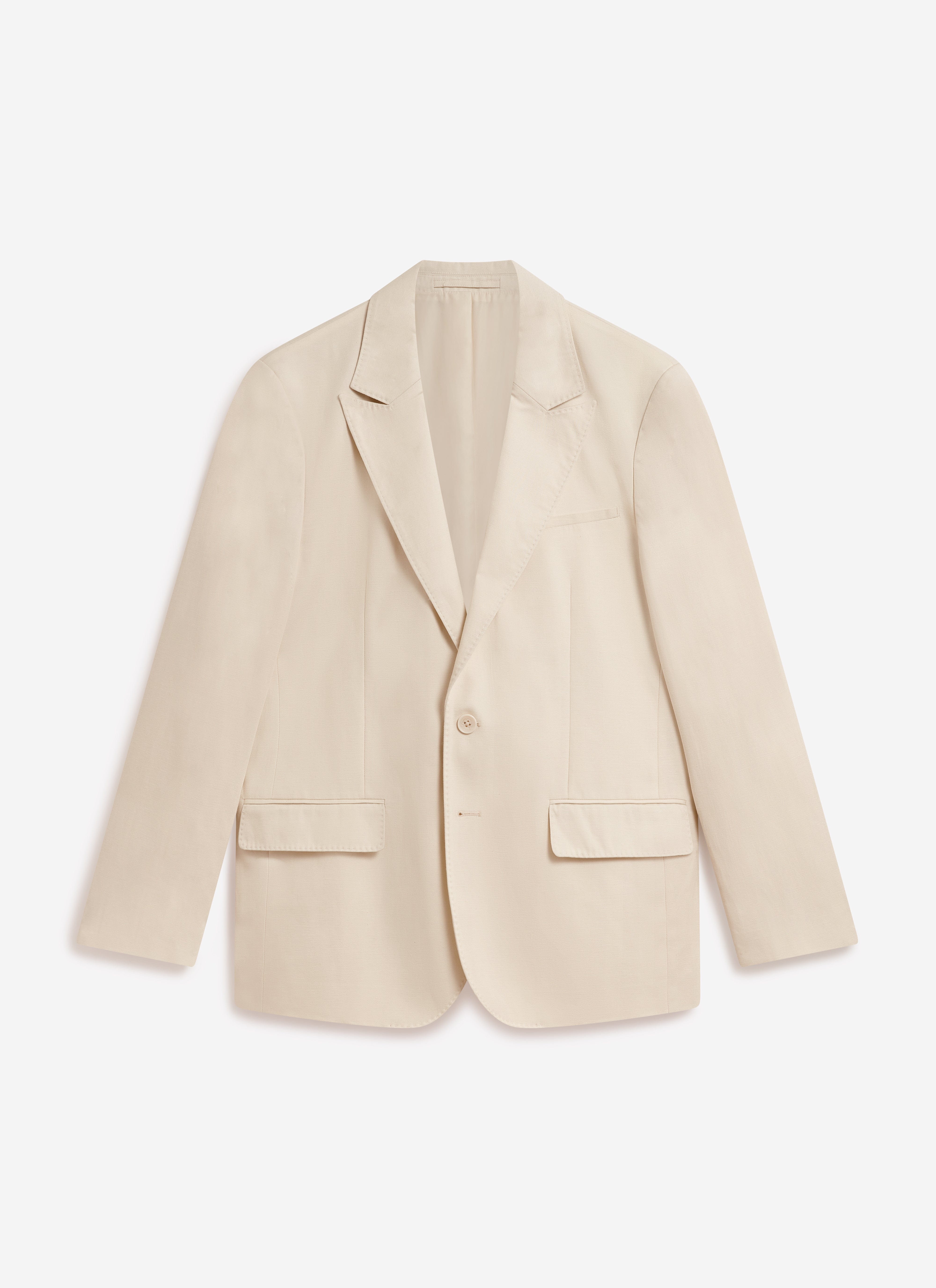 A studio photograph of the Percival x Warren Lyocell Tailored Blazer in ecru, laid flat against a plain background.