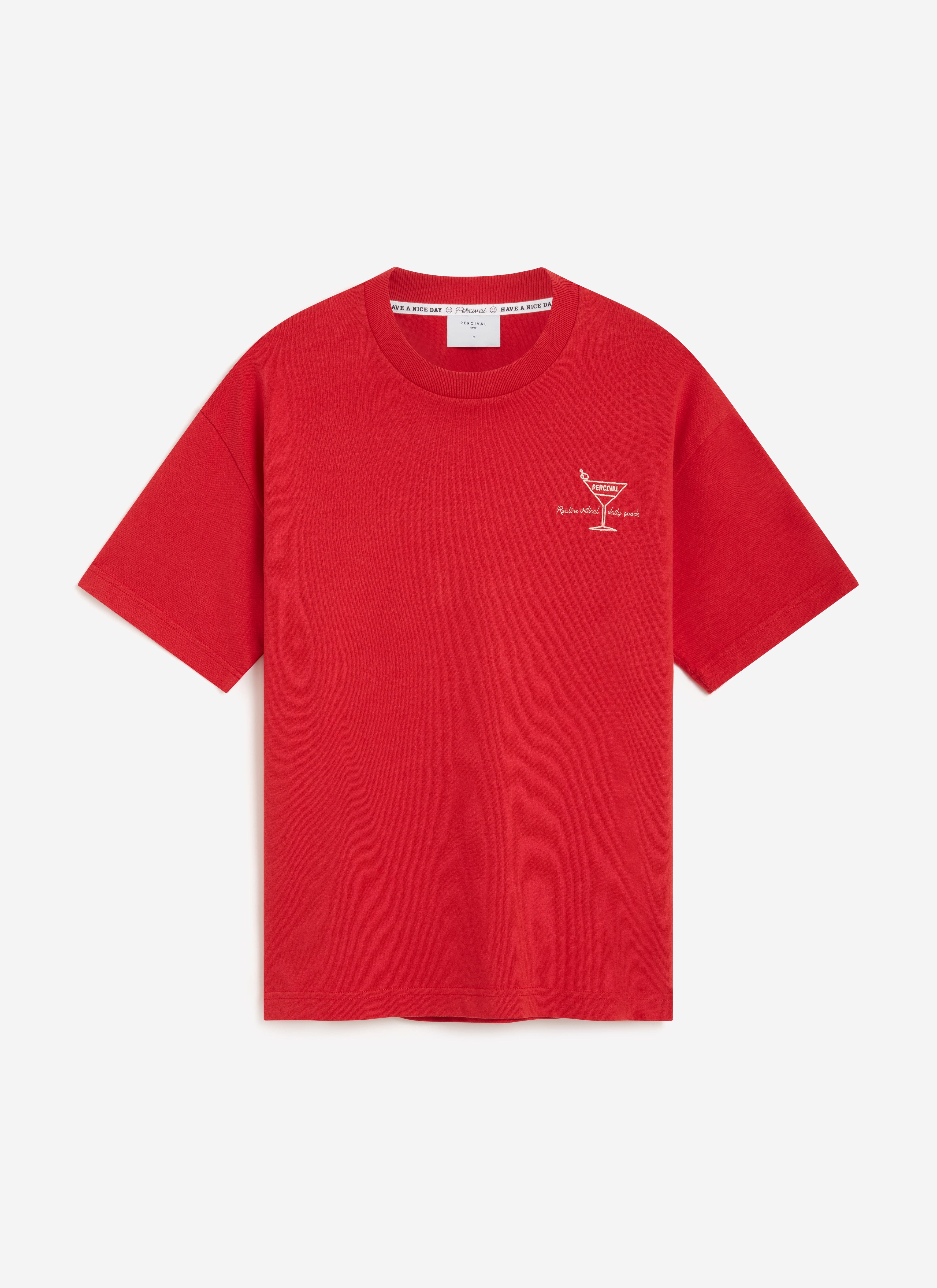 The Percival Martini oversized t-shirt in red organic cotton, laid flat to showcase the Martini glass chest embroidery.