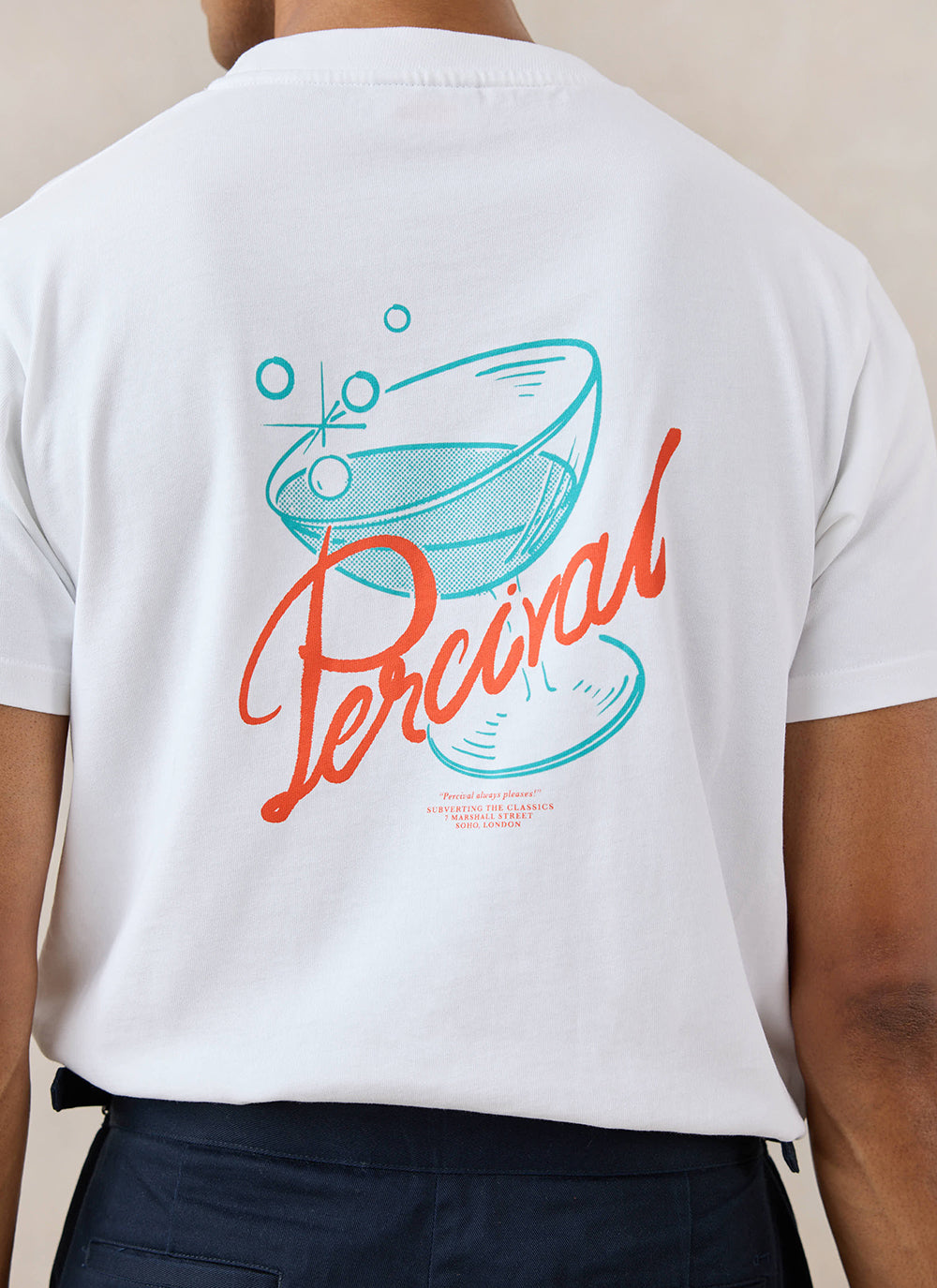White Percival Norman organic cotton T-shirt, shown from behind with a cocktail graphic and red script on the back.