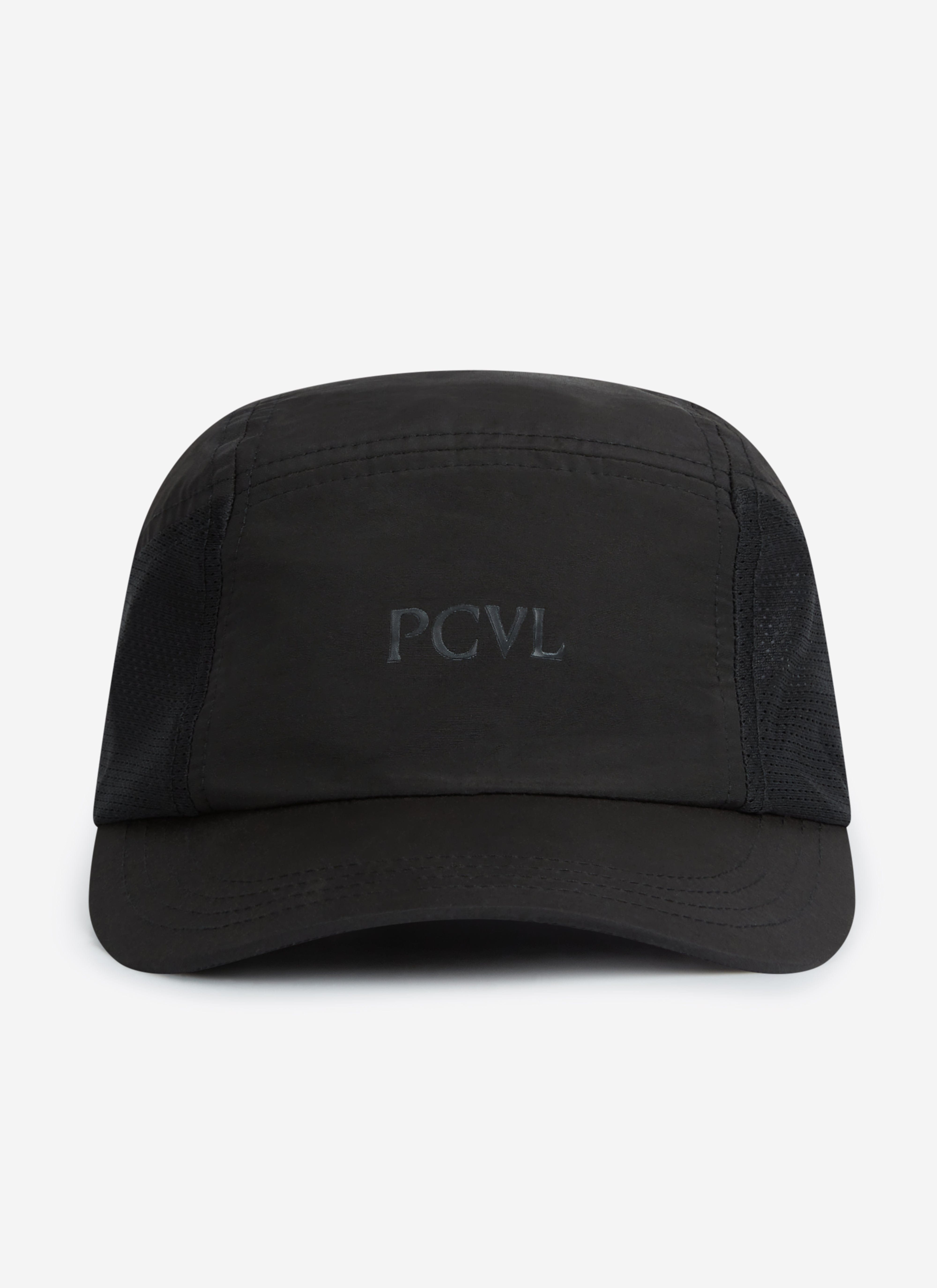 A front-on studio photograph of the black PCVL Nylon Cap by Percival, showing the tonal 'PCVL' embroidery.