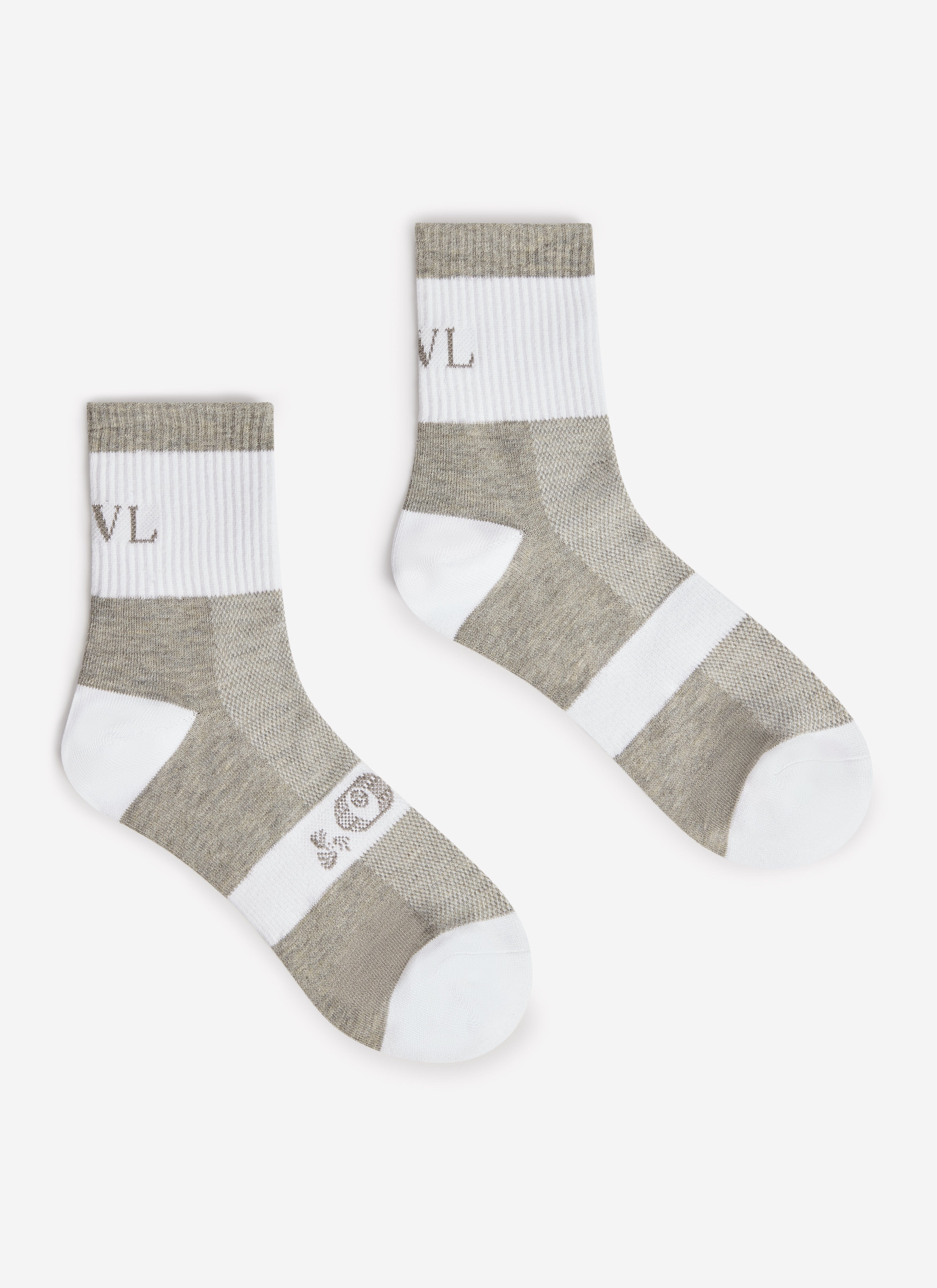 A pair of the PCVL Performance Socks in white and grey by Percival, laid out against a plain background.