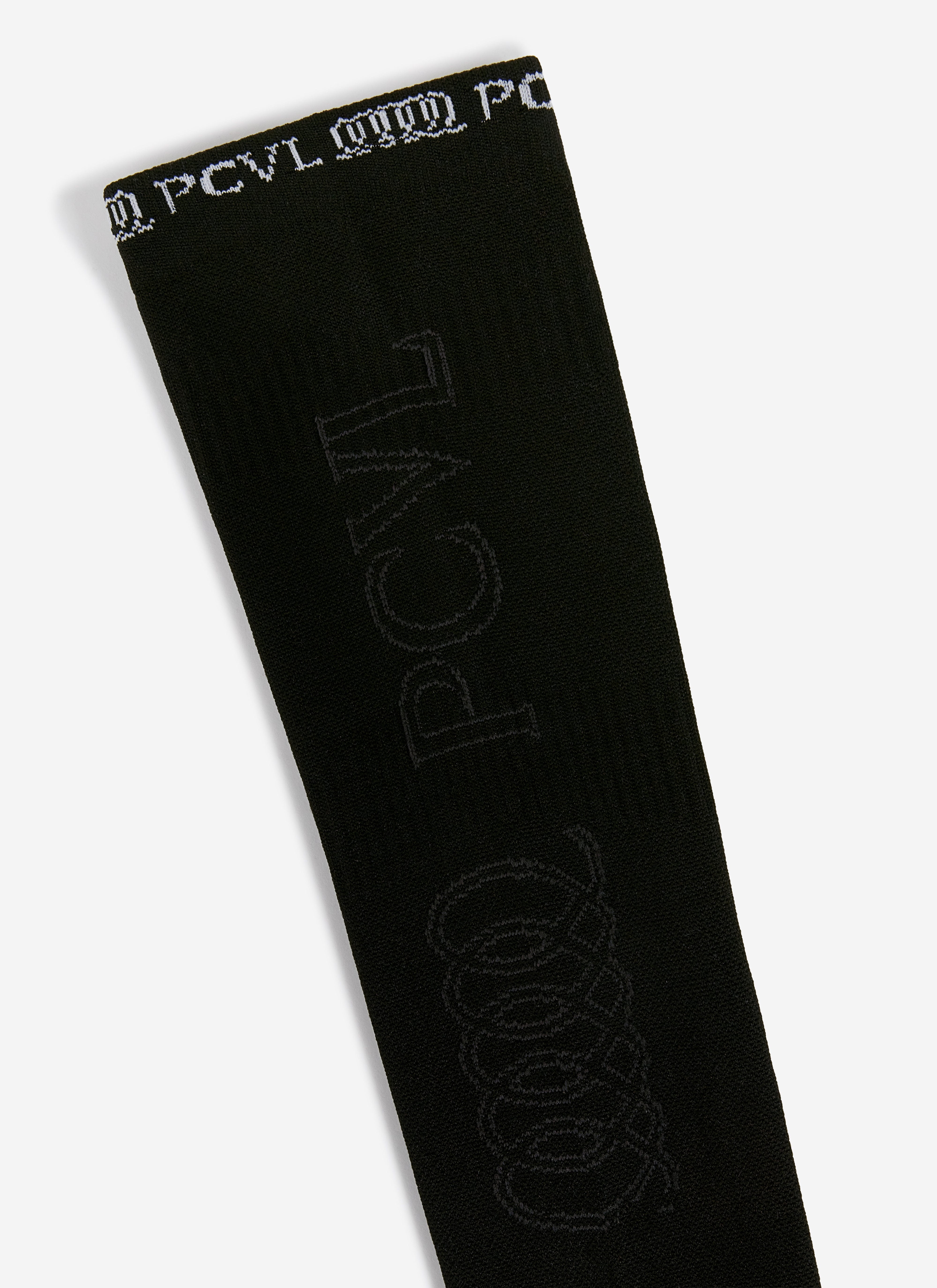 A close-up of the Percival PCVL Arm Compression sleeve in black, showing the detailed white and tonal jacquard branding.