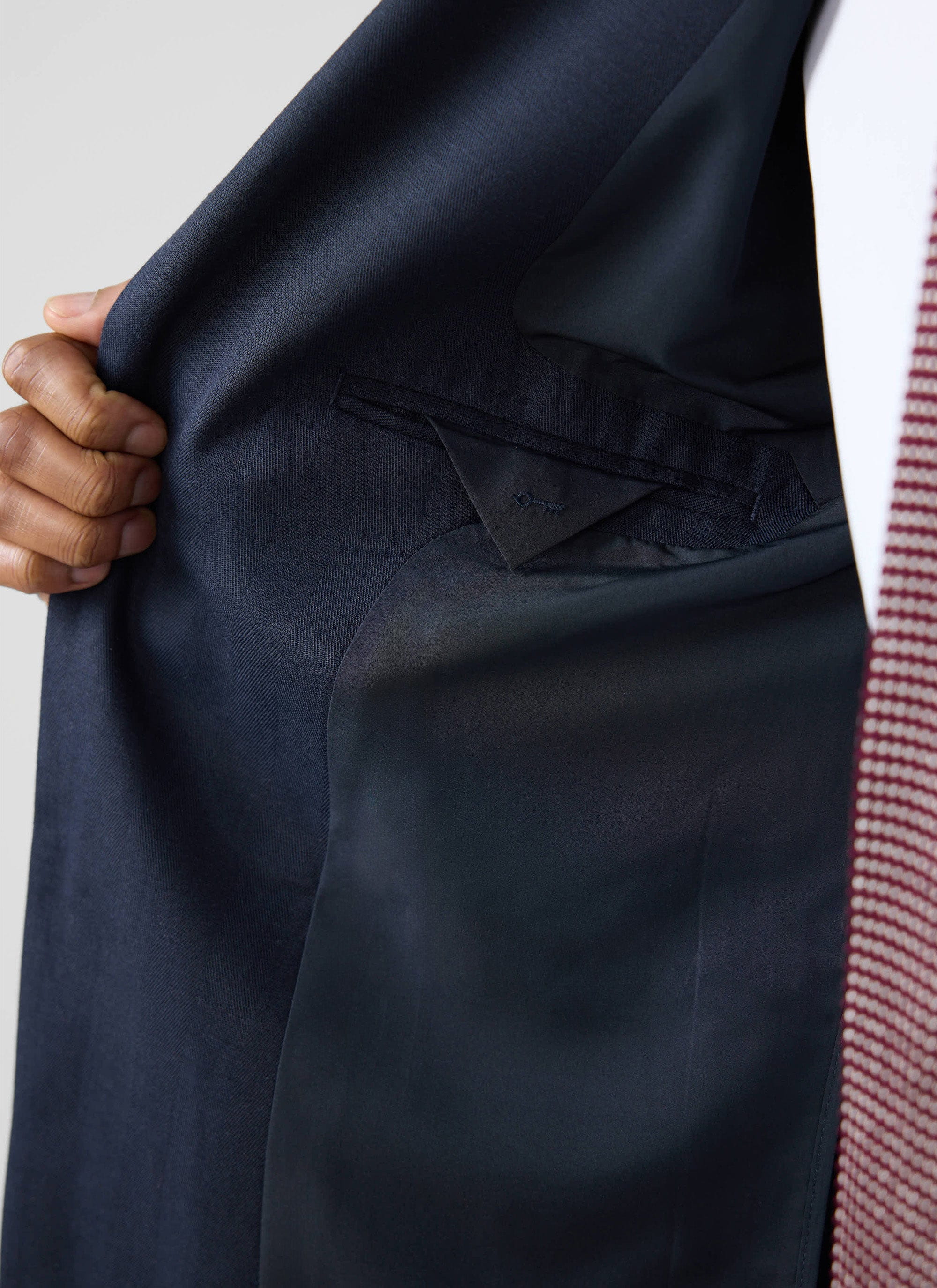 Close-up of the inner pocket and navy lining of the Lyocell Regular Blazer in navy by Percival.