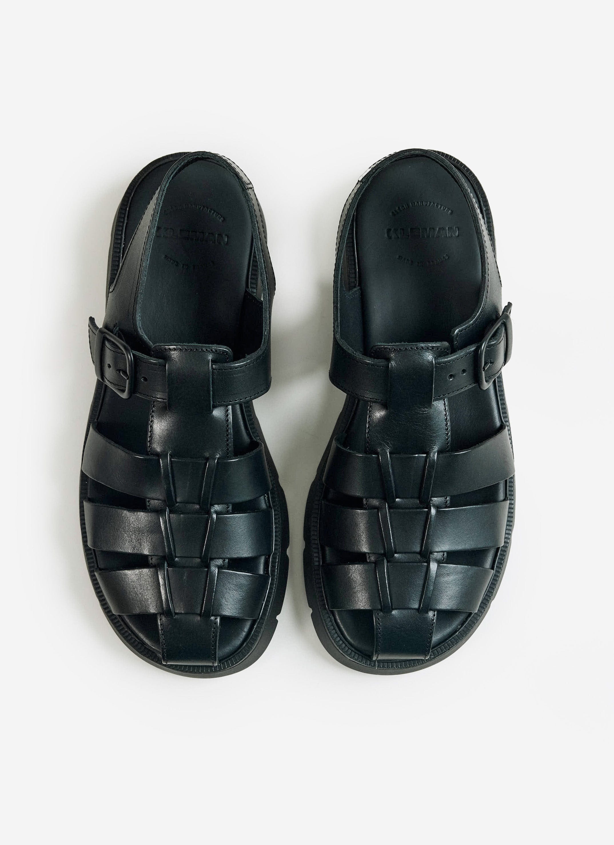 A pair of black Kleman Babord VGT fisherman sandals from Percival, featuring a leather weave and buckle closure.