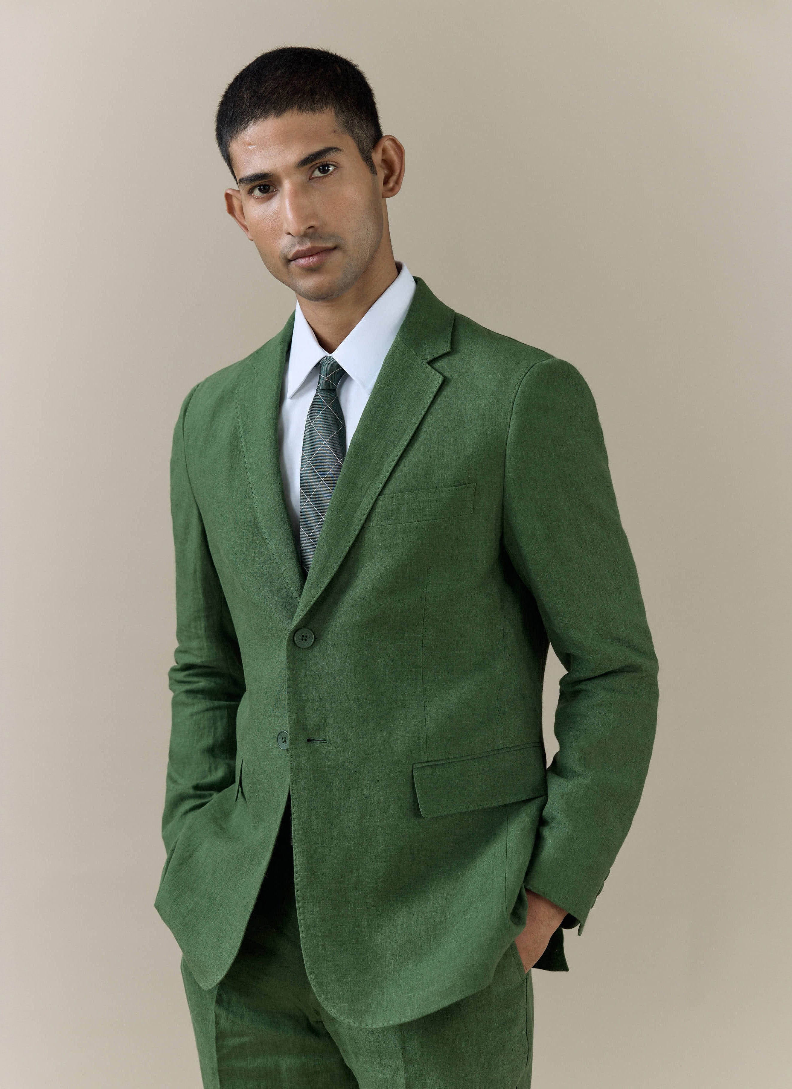 Forest green Slim Fit Classic Blazer in linen by Percival, shown on a model with a white shirt and patterned tie.