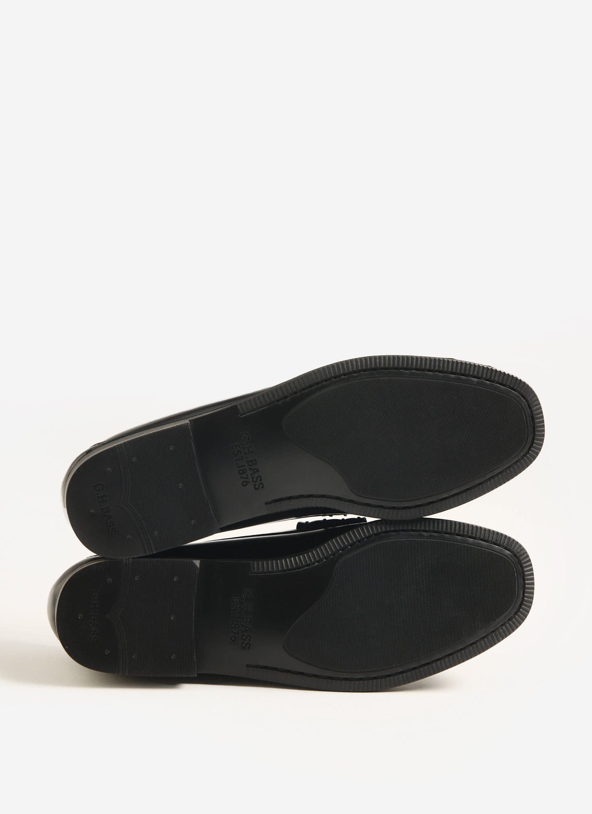 The durable rubber soles of the G.H. Bass Weejuns Larson Flag loafers in black leather, available from Percival.