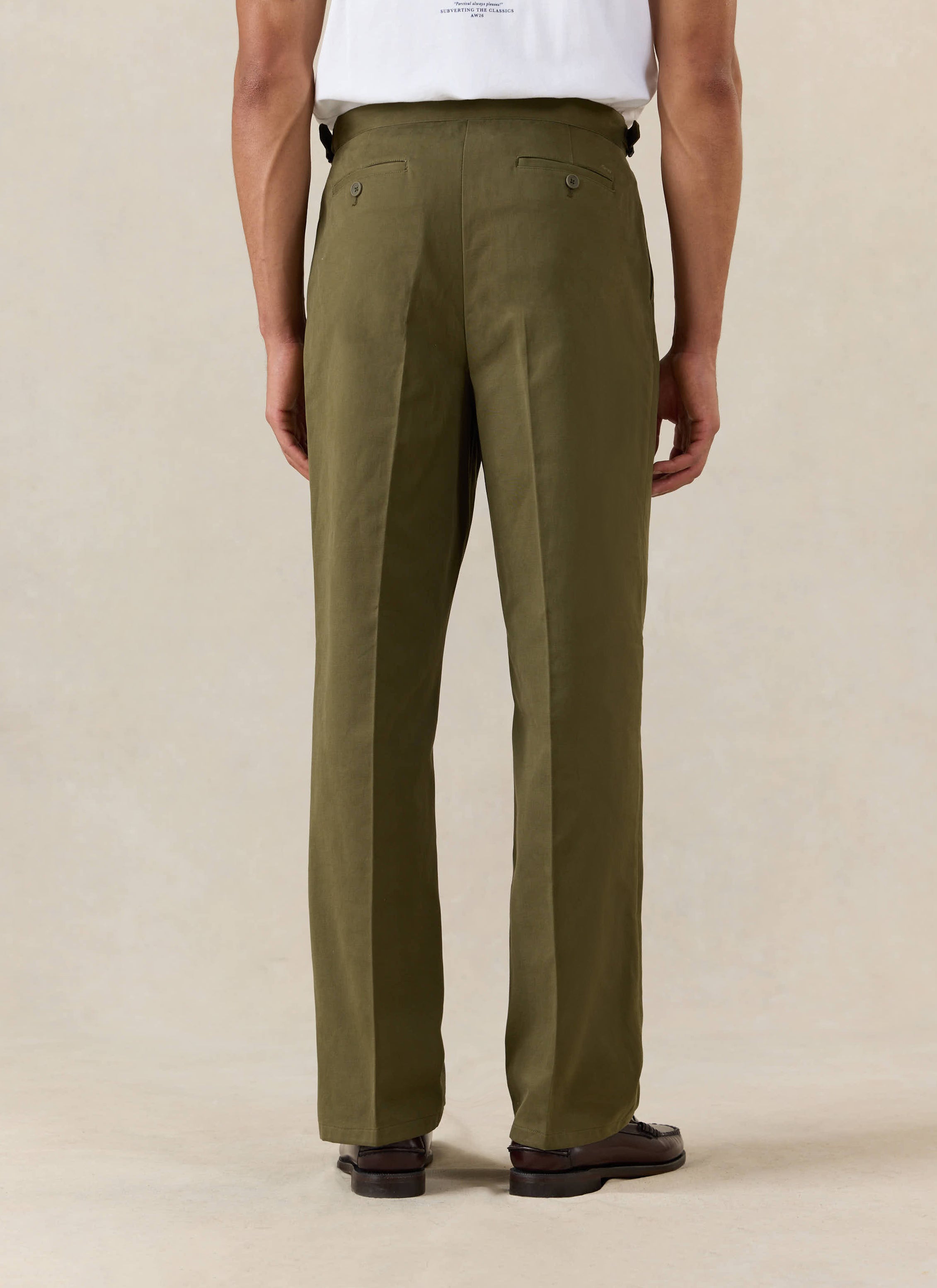 A model wears the Percival Blake Double Pleated Tailored Trousers in forest green brushed moleskin, shown from the back.