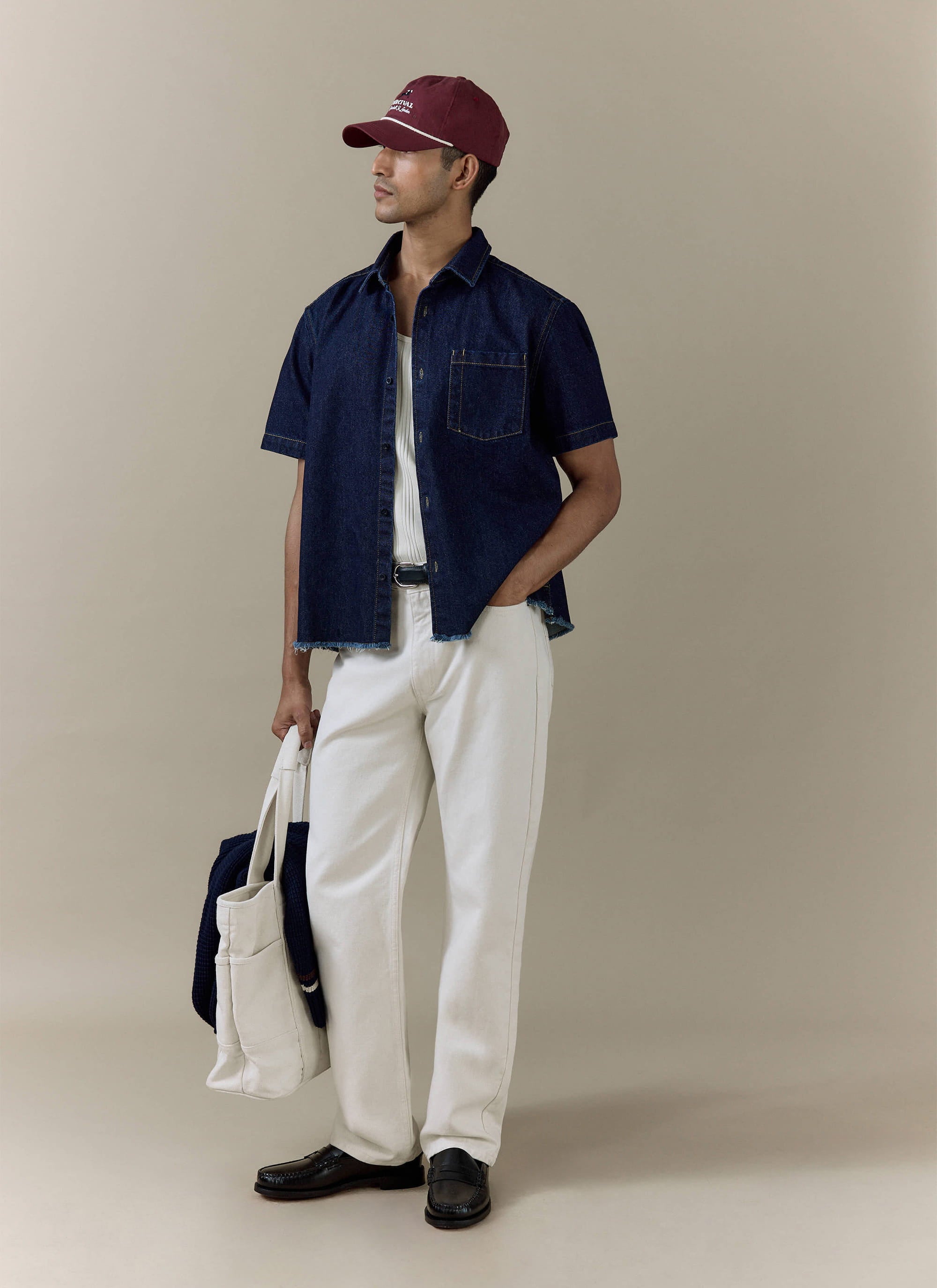 Percival Harley denim cropped boxy shirt in dark indigo cotton, styled with cream straight leg jeans.