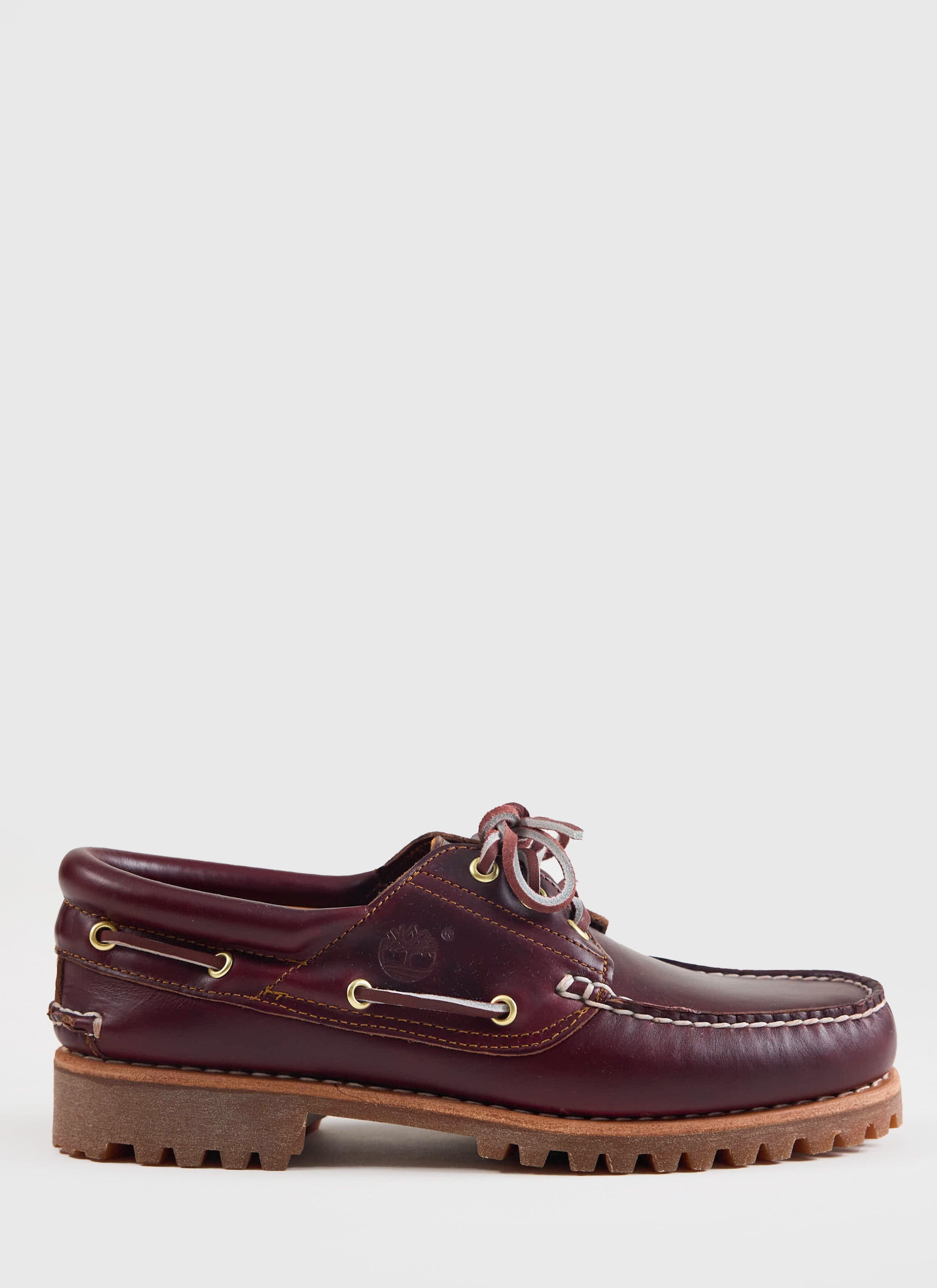 Side profile of the Timberland Authentic Boat Shoe in burgundy leather with a lug sole, from Percival.