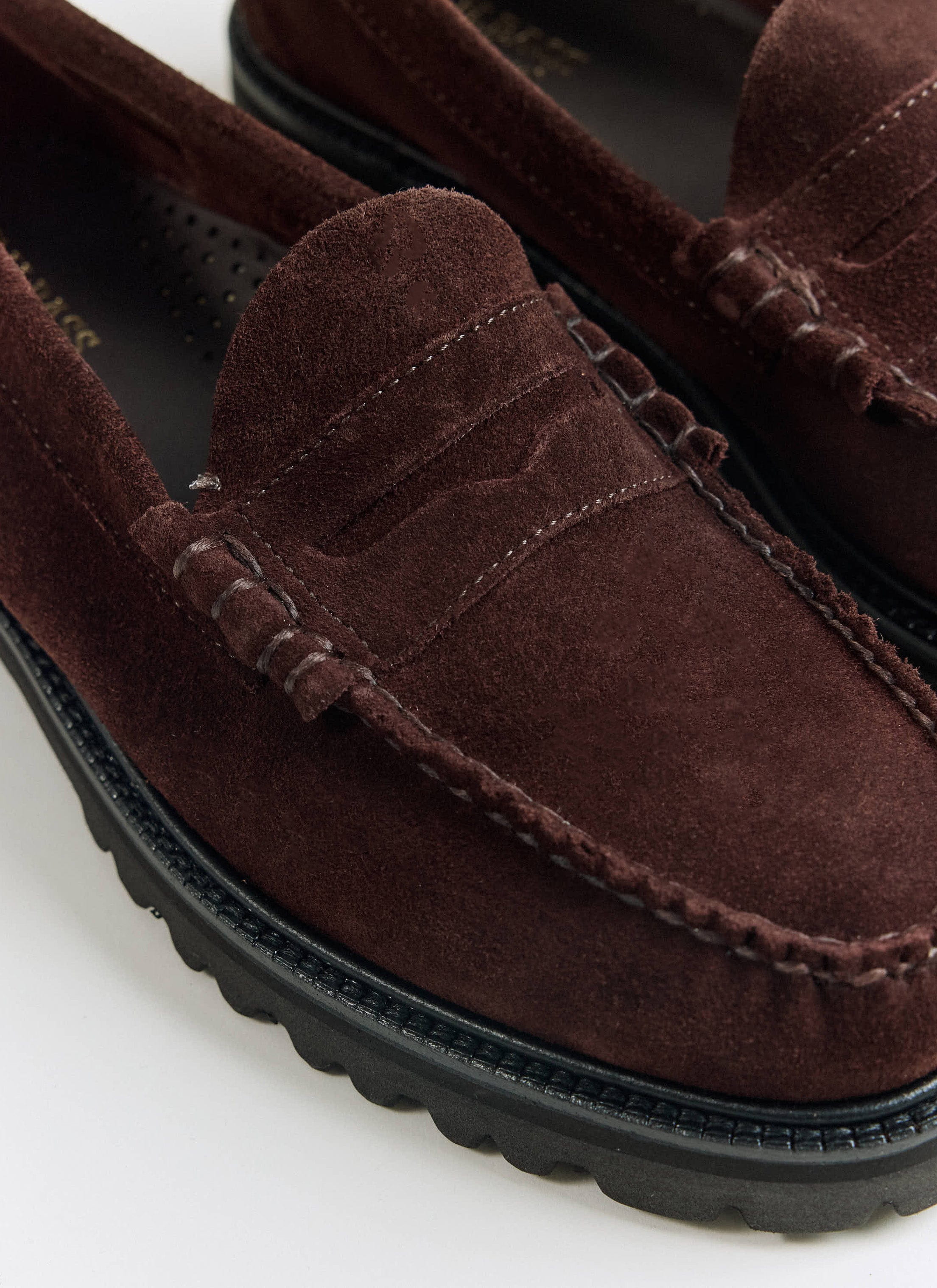 A close-up of the G.H. Bass Weejun 90 Larson loafers in chocolate suede from Percival, showing tonal hand-stitched seams.