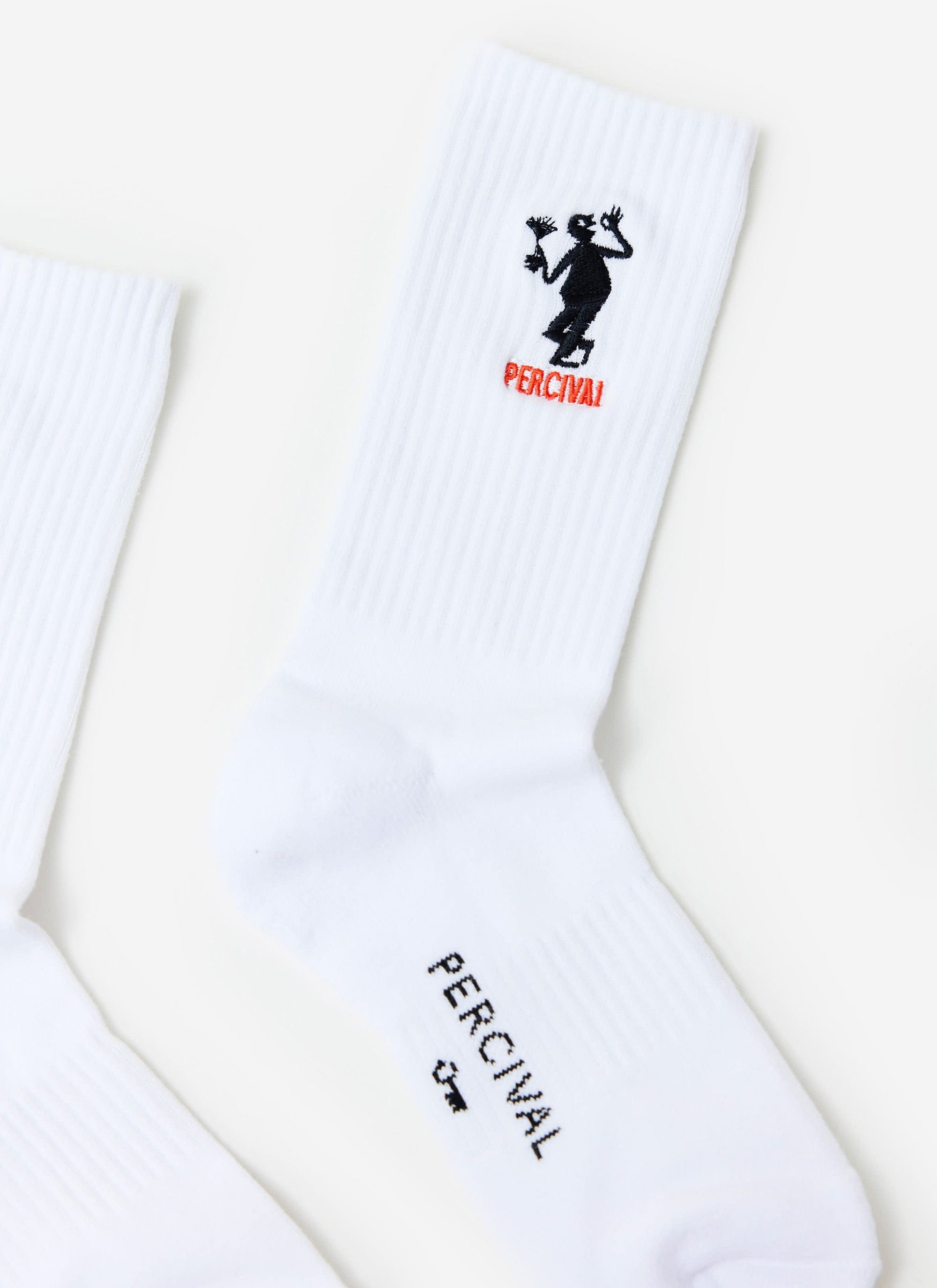 A close-up of the Percival Carlo Mixologist Embroidered Socks, showing the detailed embroidery against the white cotton.