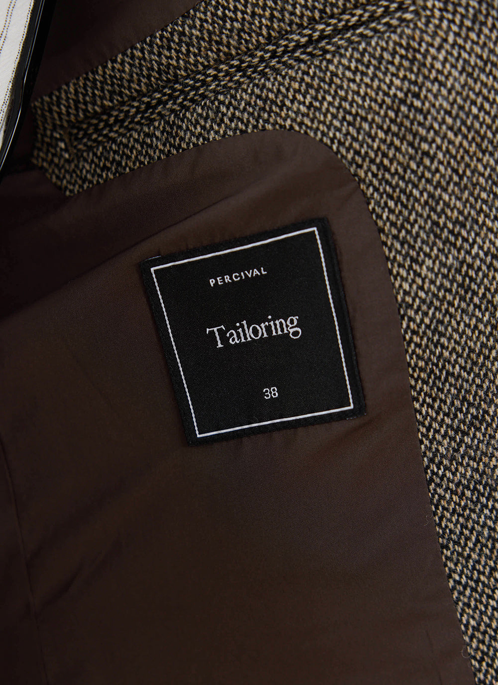 Grey showing a close-up of the internal label and brown lining.