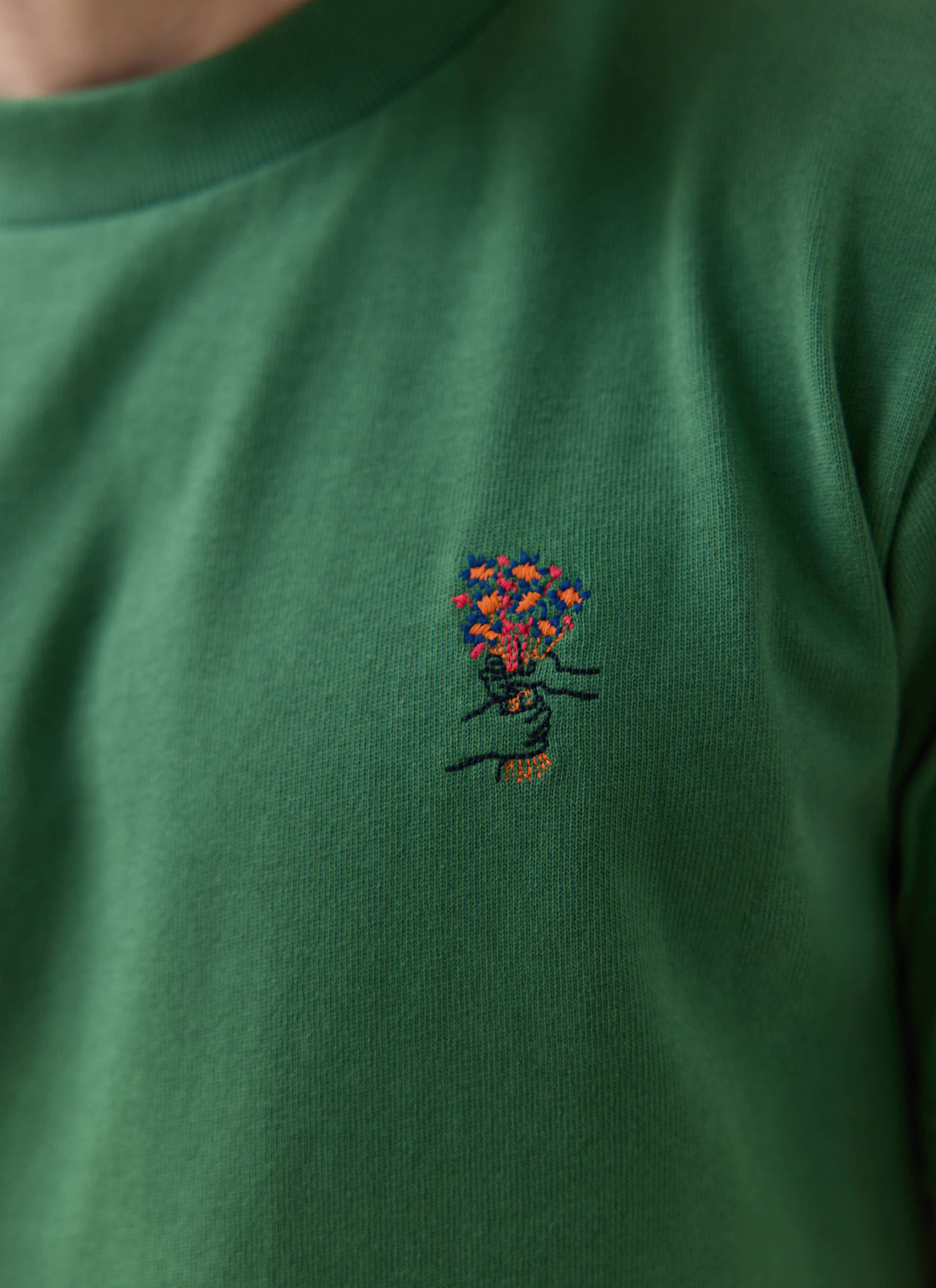 Forest green Percival Davies T-shirt with hand drawn floral embroidery; want more? Check out the SS26 collection.