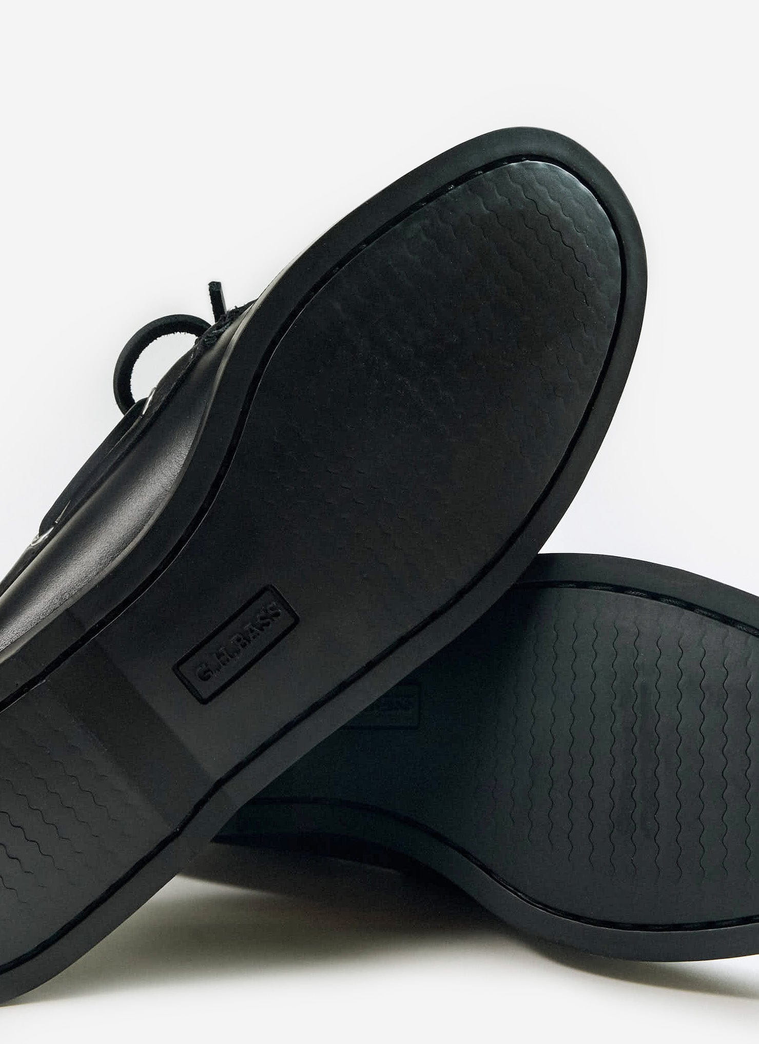 Close-up of the black rubber sole on the G.H. Bass Jetty II Boater 2 Eye shoe from Percival, showing the wavy grip pattern.