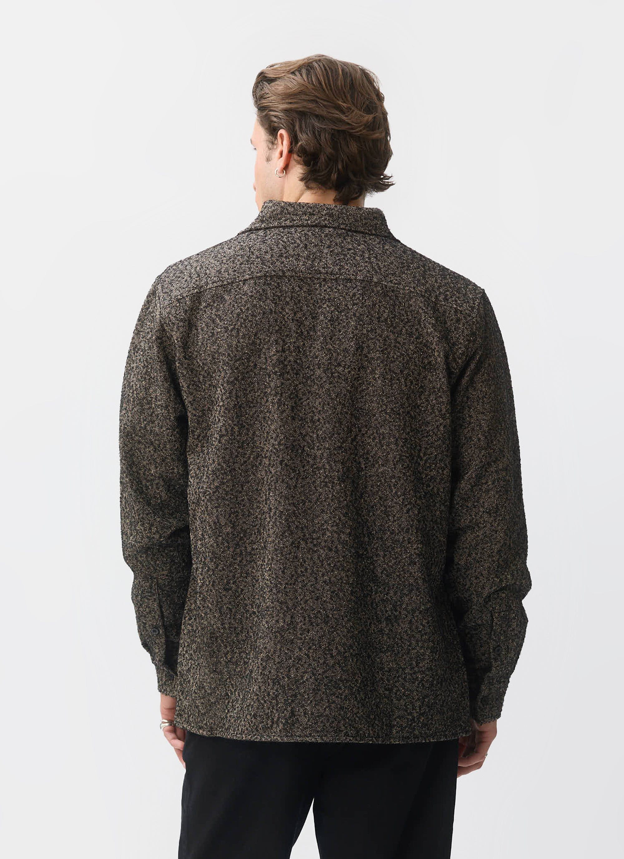 Back view of a model wearing the Percival Blyton Long Sleeve Shirt in a textured grey nep fabric against a white background.