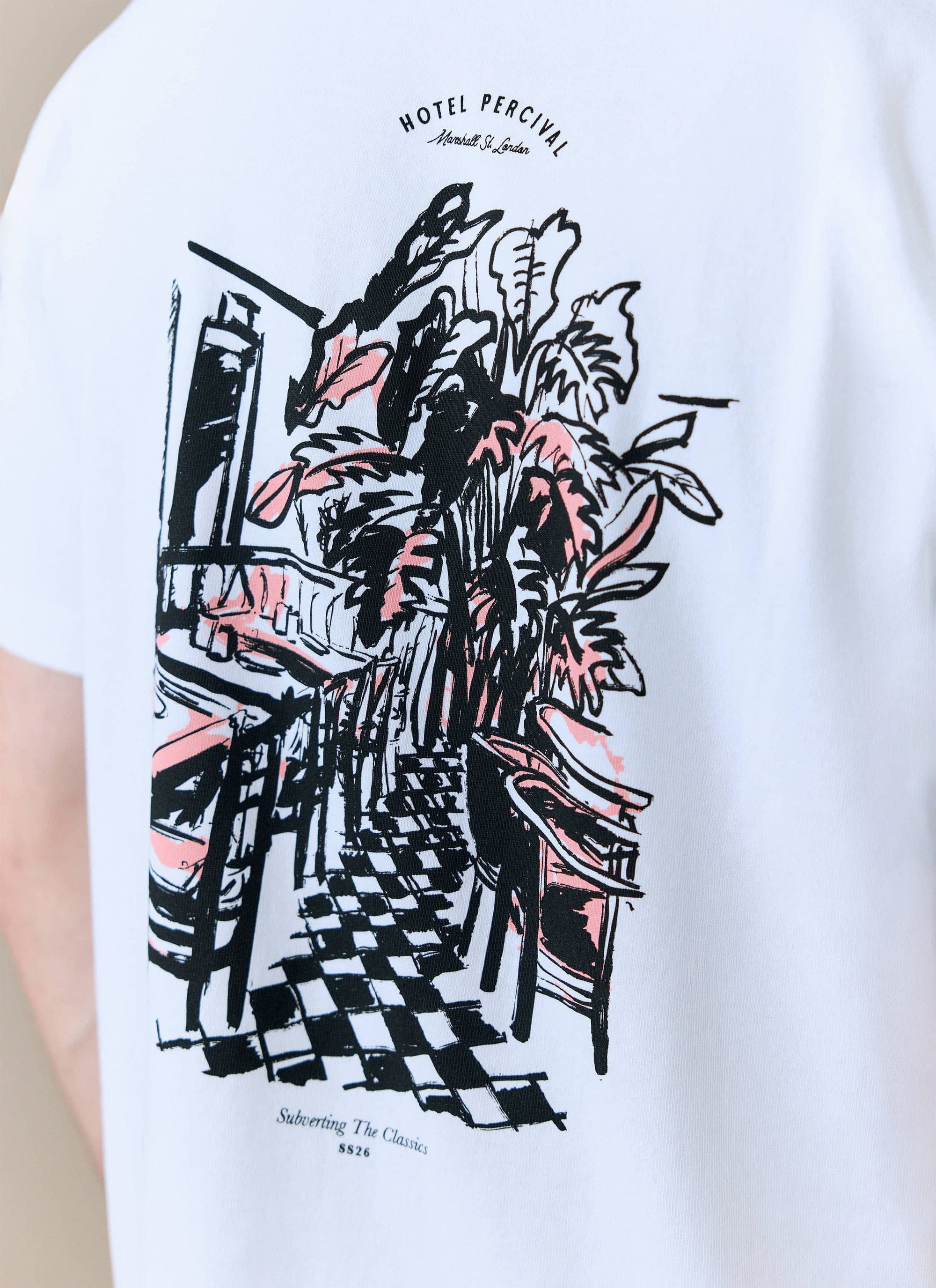 A close-up of the hand-illustrated Hotel Bistro graphic on the back of the white oversized t-shirt from Percival.