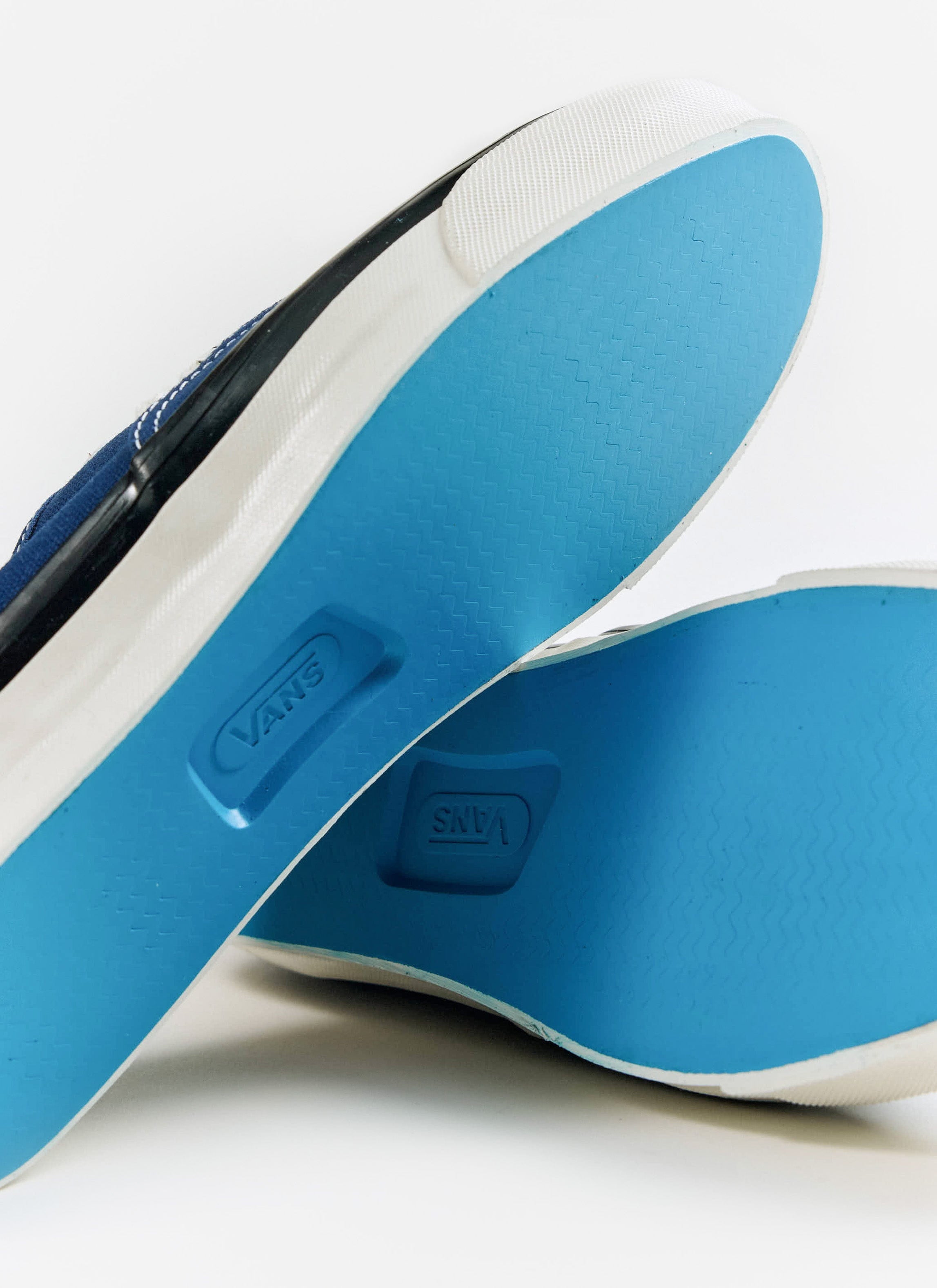 Close-up of the bright blue textured soles and Vans logo on the Premium Authentic 44 shoes, available from Percival.