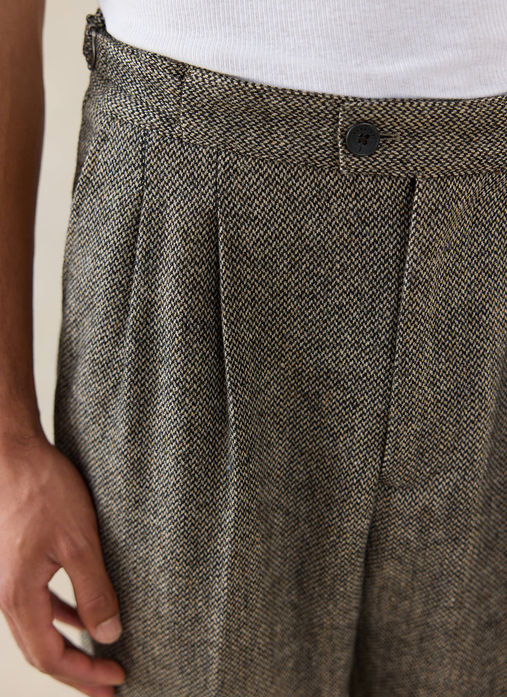 Percival Blake Double Pleated Tailored Trousers in Grey Birdseye Wool, showing a close-up of the pleats and fabric texture.
