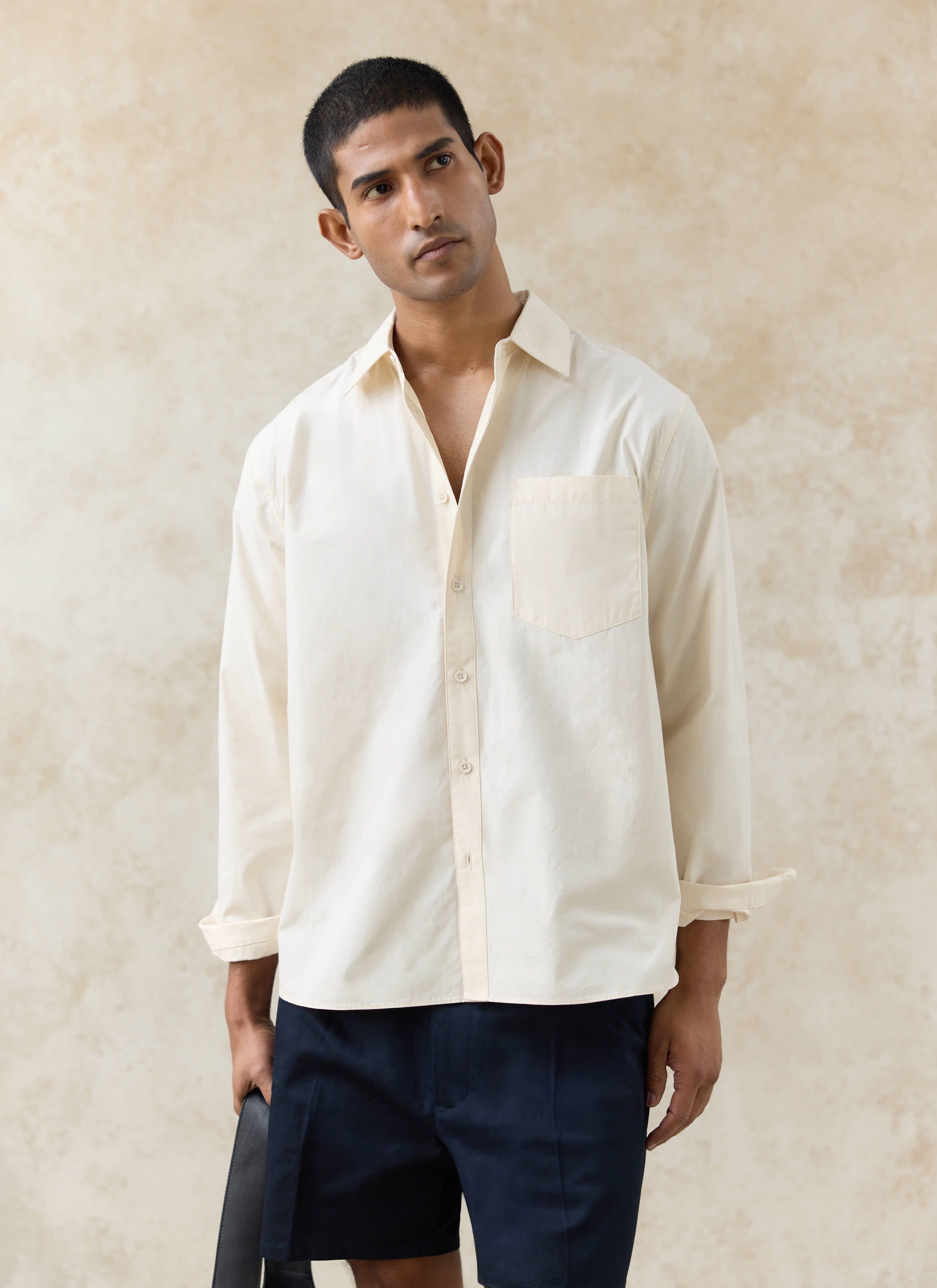 Percival Dali Relaxed Poplin Shirt in cream cotton, worn by a model with a point collar and single chest pocket.